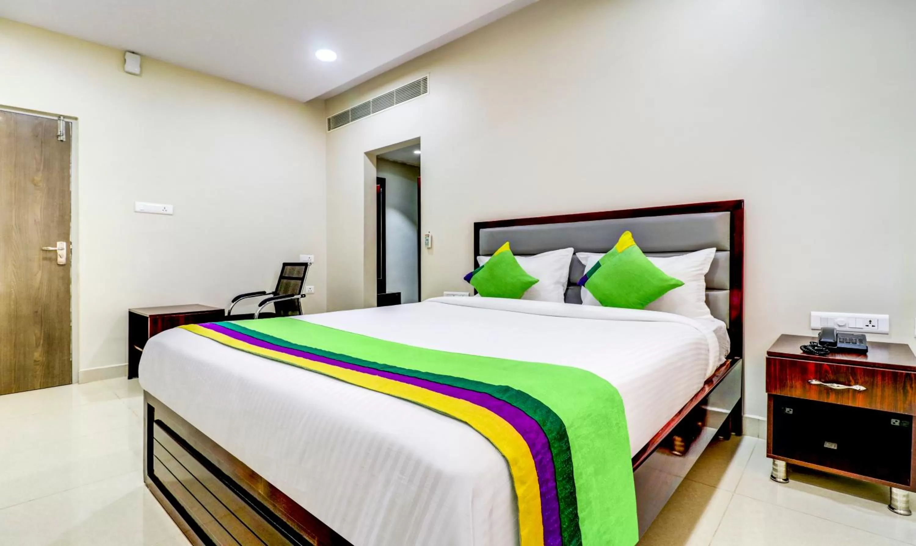 Bedroom, Bed in Treebo Grand Milan