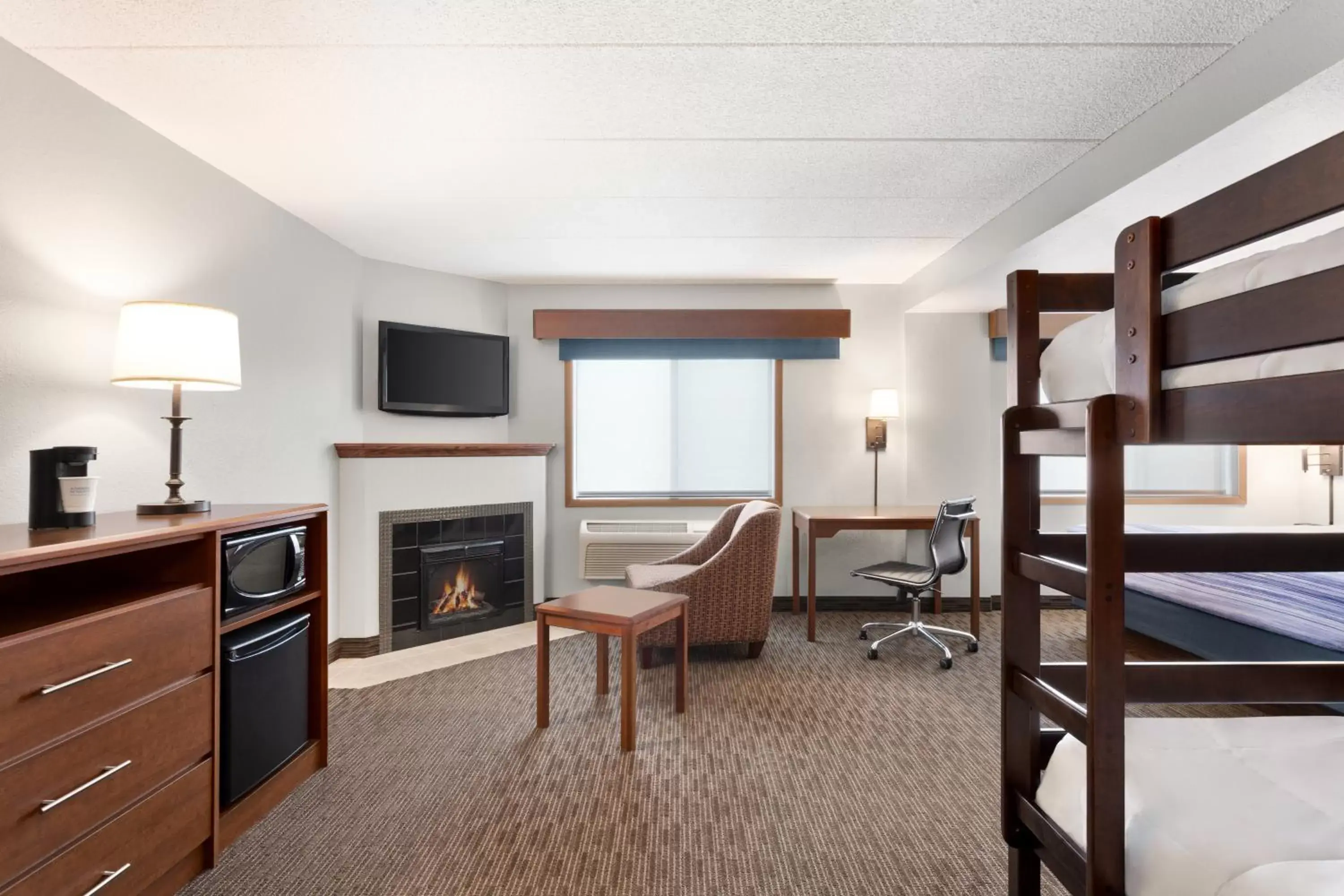 King Suite with Bunk Beds and Fireplace - Non-Smoking in AmericInn by Wyndham Sauk Centre