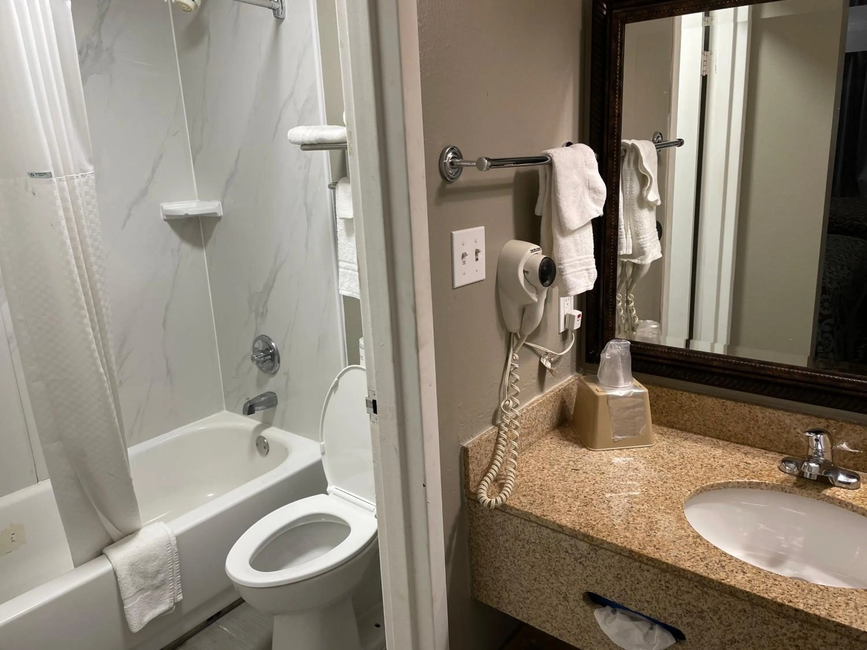 Bathroom in Days Inn & Suites by Wyndham Collierville Germantown Area