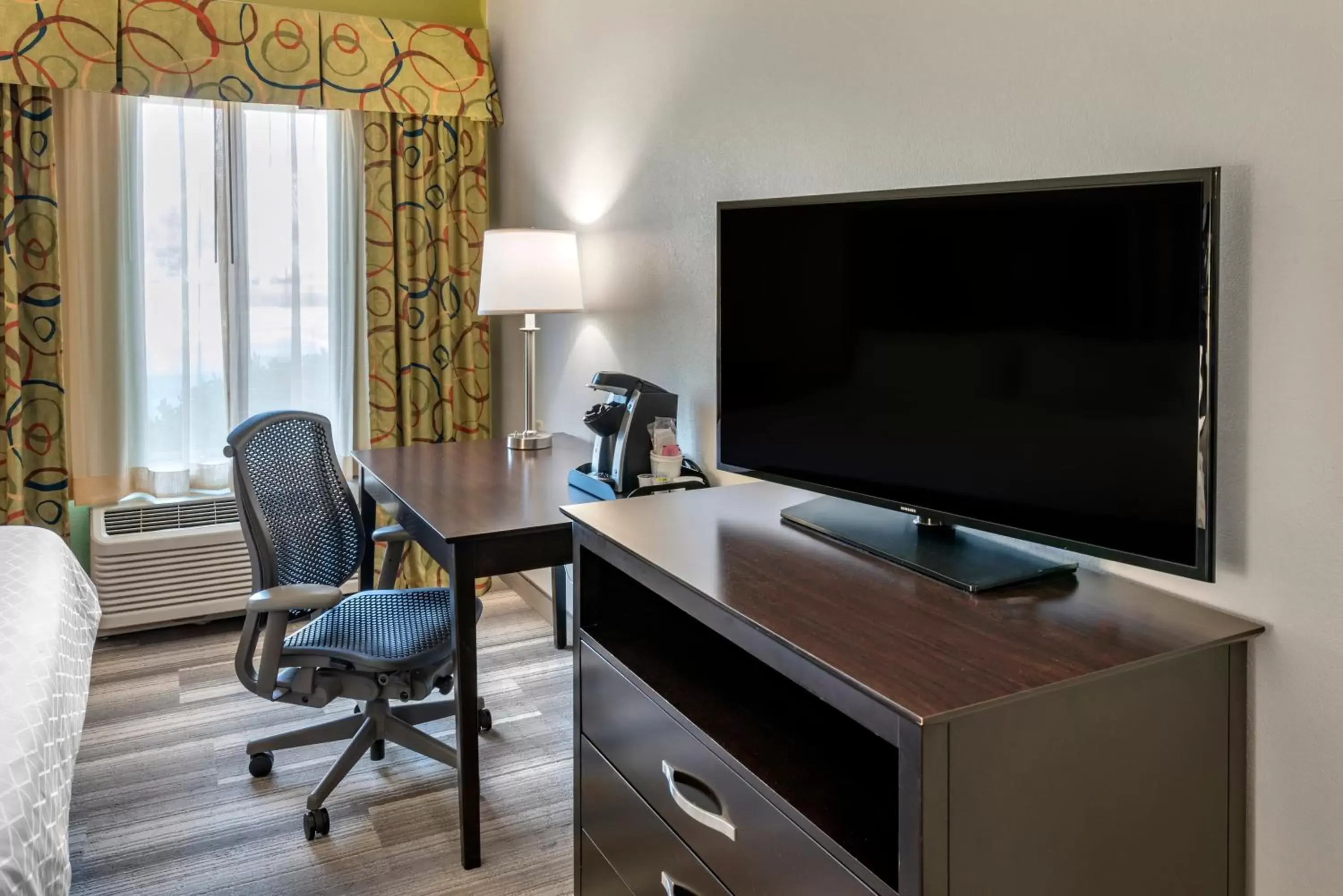Photo of the whole room, TV/Entertainment Center in Holiday Inn Express Hotel & Suites Cincinnati-Blue Ash, an IHG Hotel