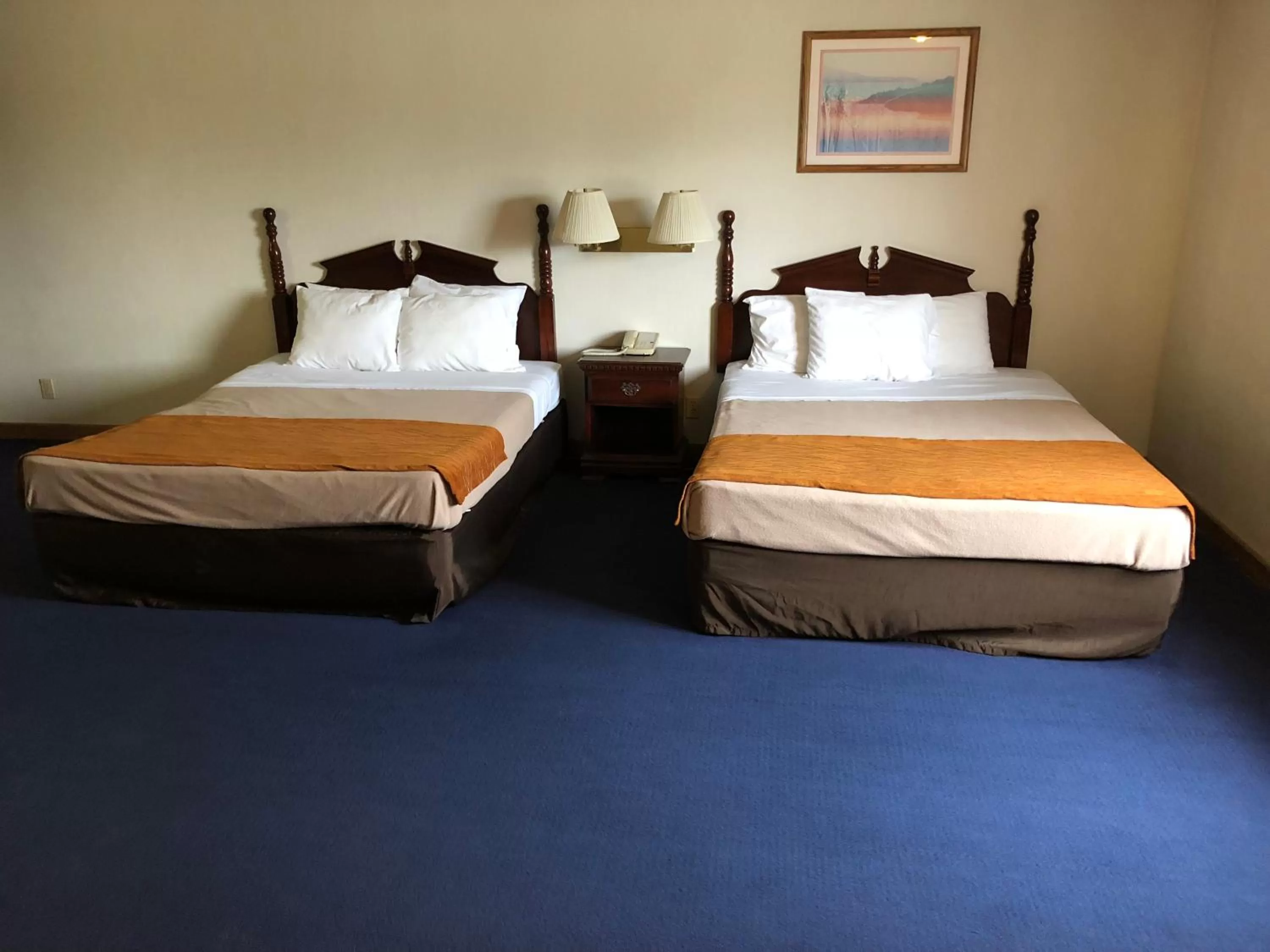 Bedroom in Denison Inn & Suites