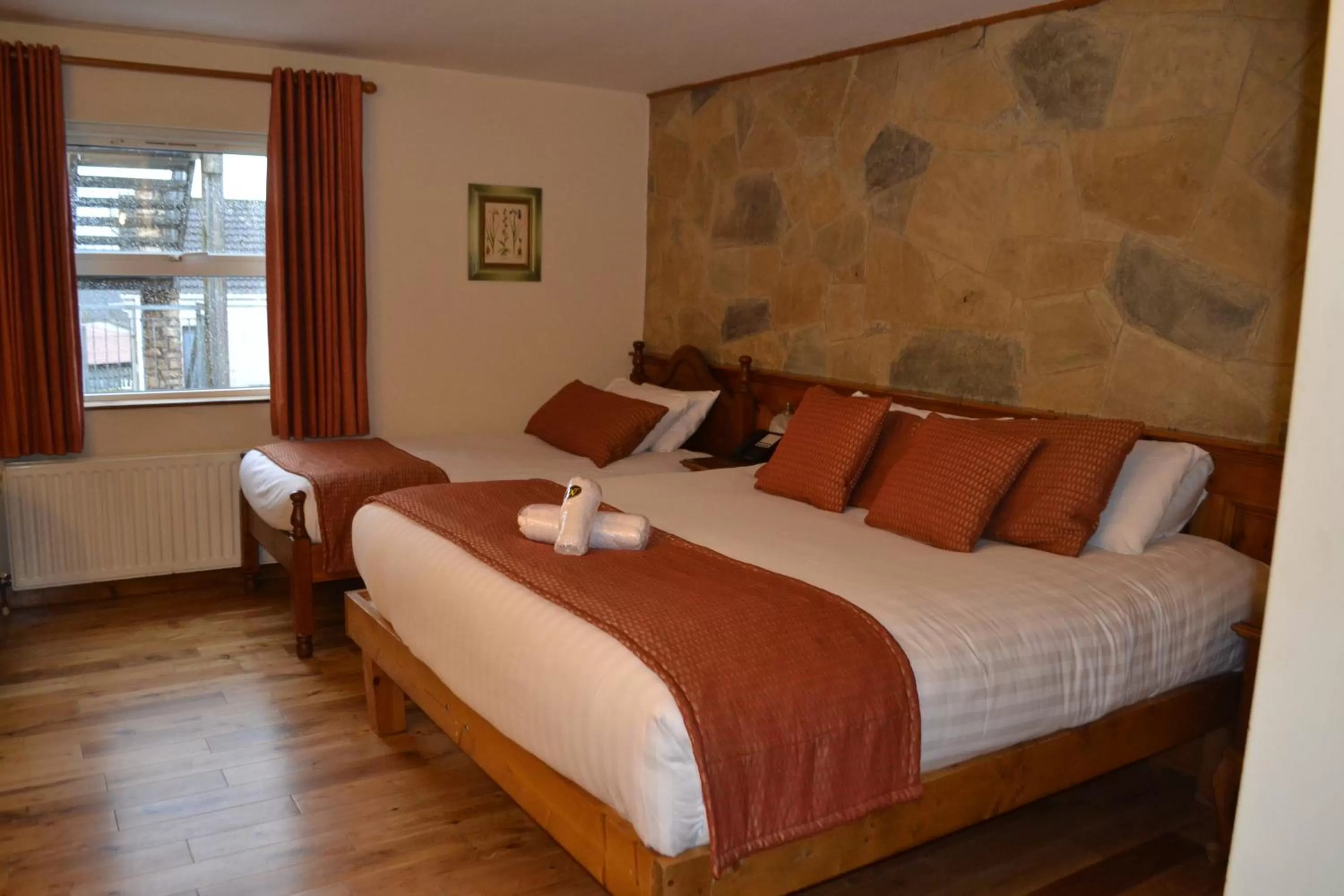 Bed in Walsh's Hotel and Apartments