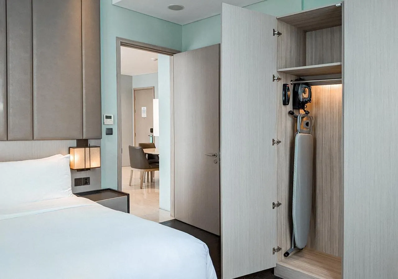 Bed in Crowne Plaza Jakarta Residences, an IHG Hotel