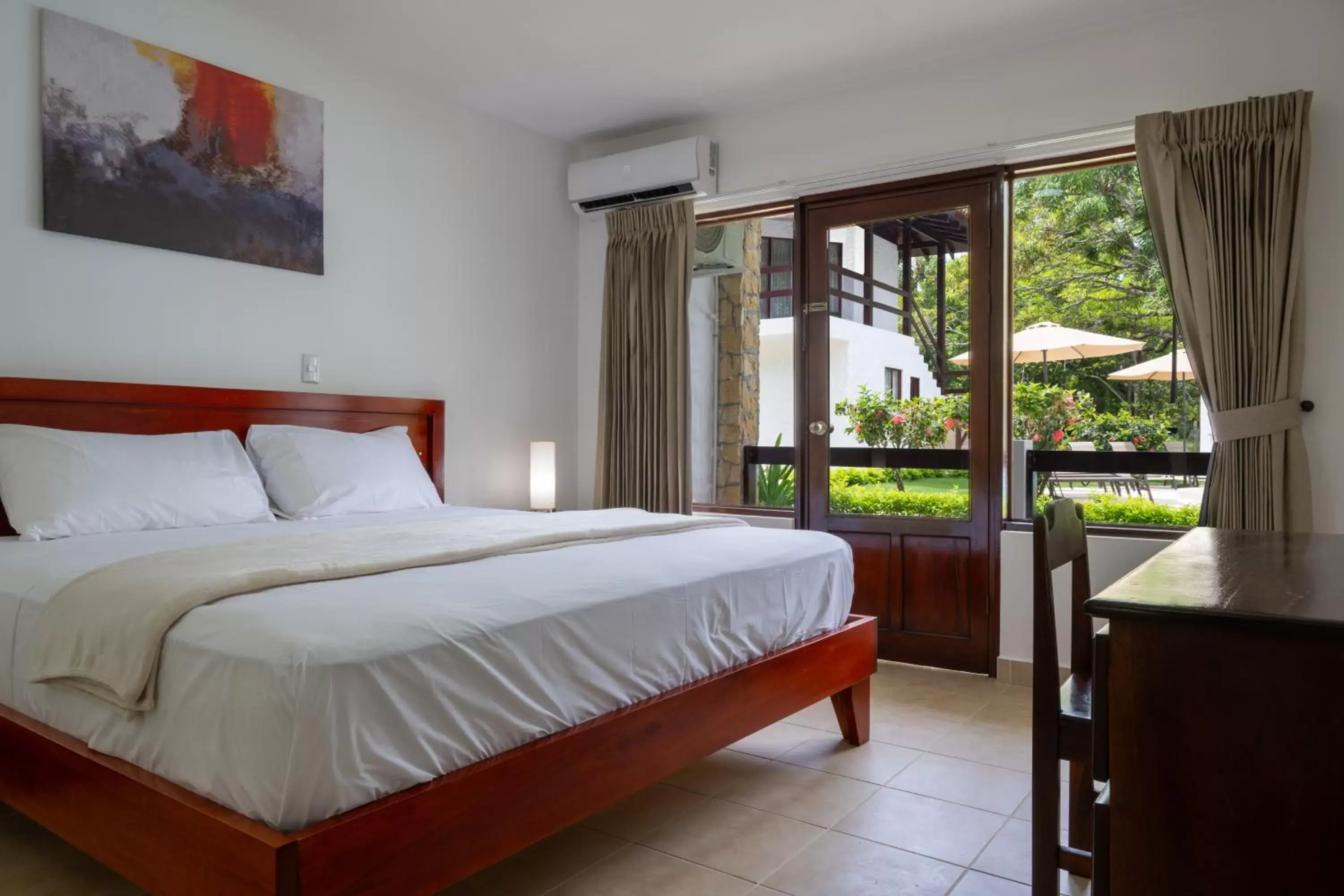 Bedroom, Bed in Fuego del Sol Beachfront Hotel