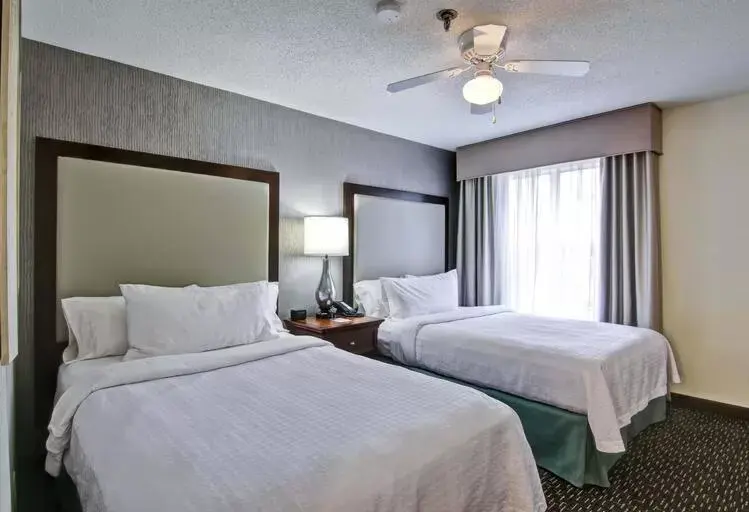 Bed in Poplar Inn and Suites