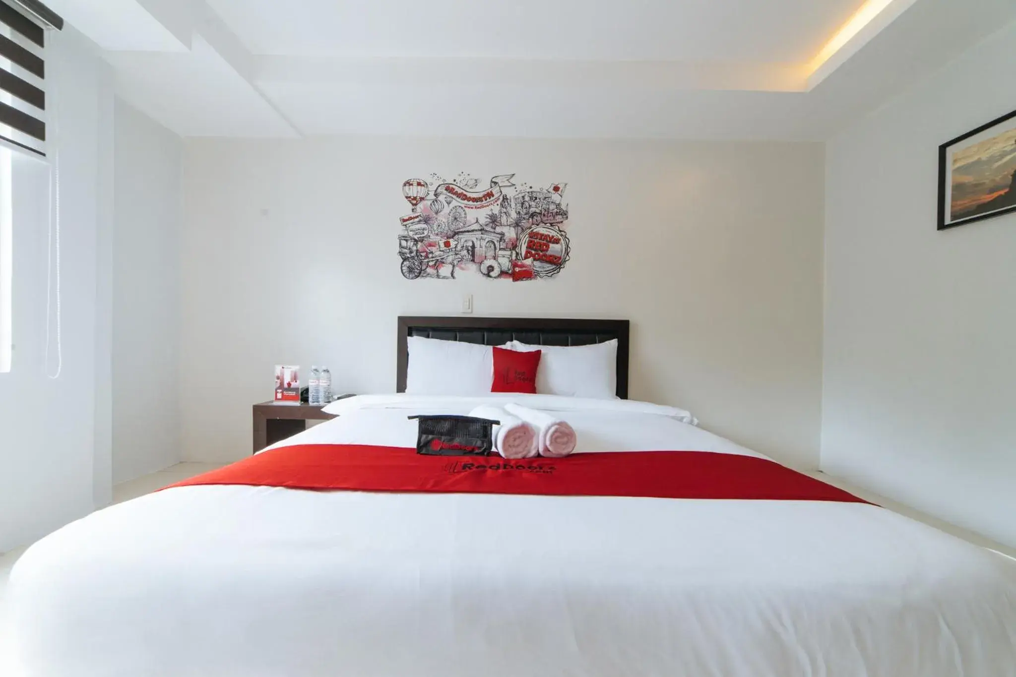 Bedroom, Bed in RedDoorz Plus at One Liberty Hotel Kalayaan Avenue