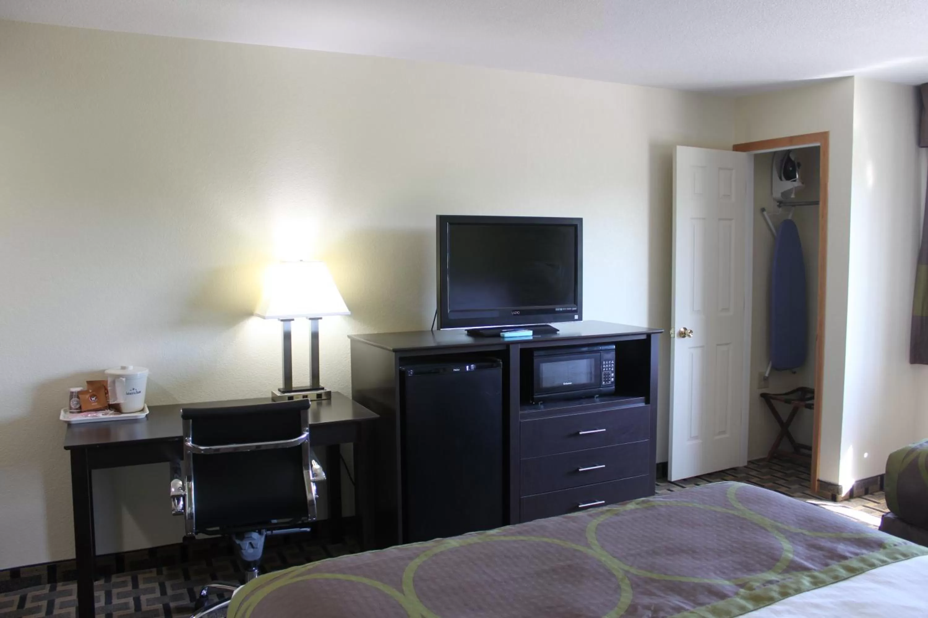 Bed in AmericInn by Wyndham West Burlington