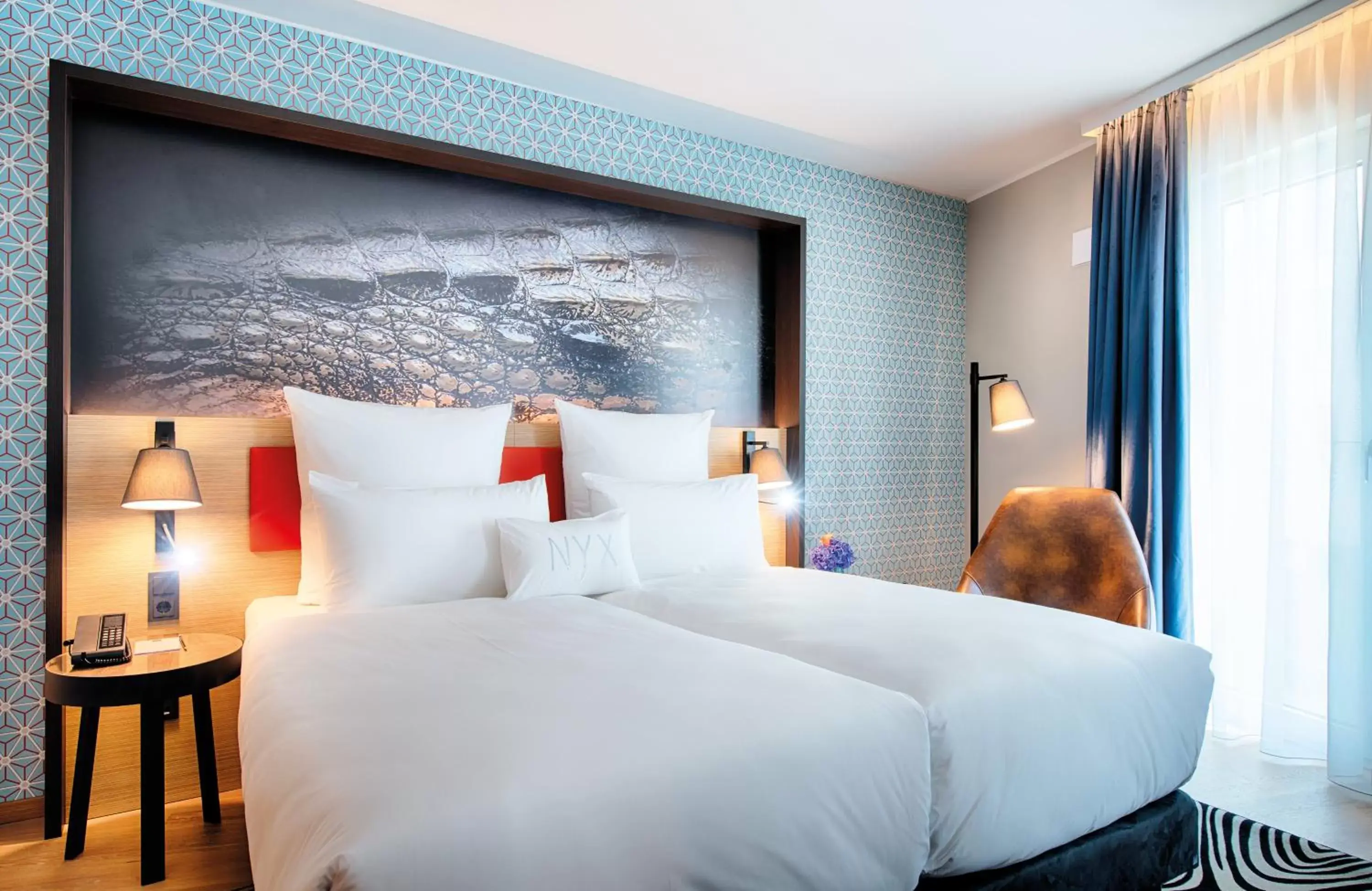 Photo of the whole room, Bed in NYX Hotel Munich by Leonardo Hotels