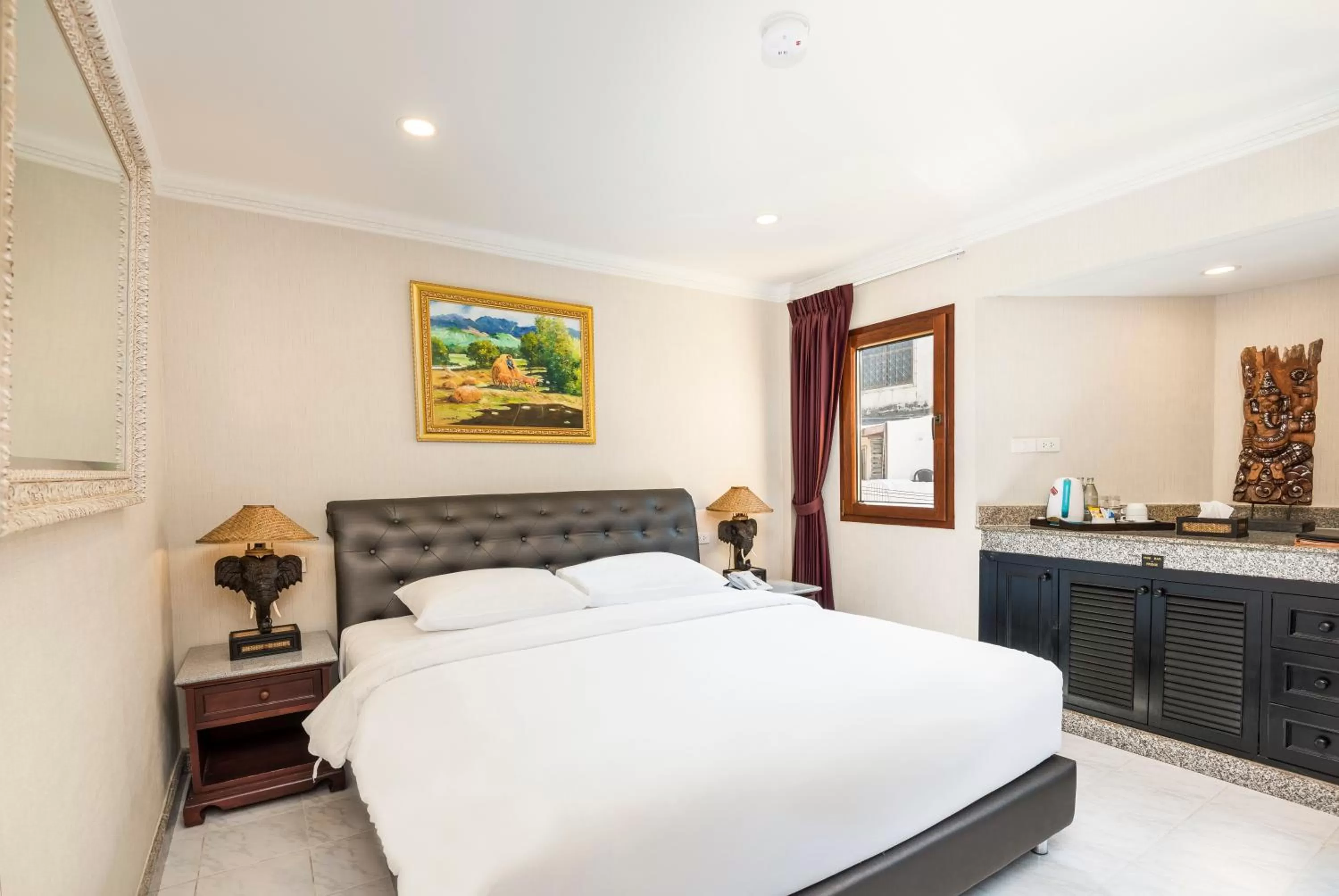 Bed in The Ambiance Hotel