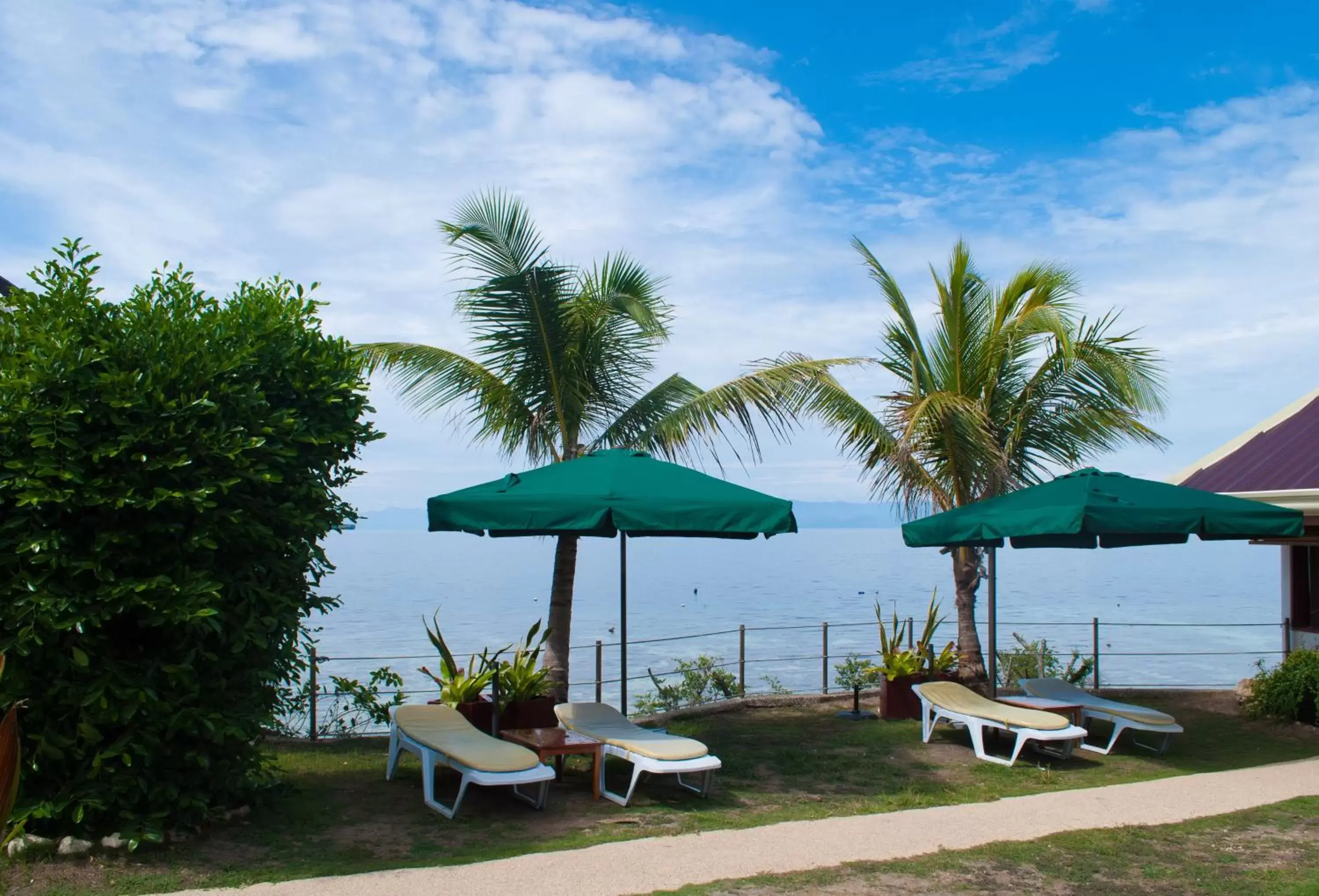 Beach, Patio/Outdoor Area in Quo Vadis Dive Resort