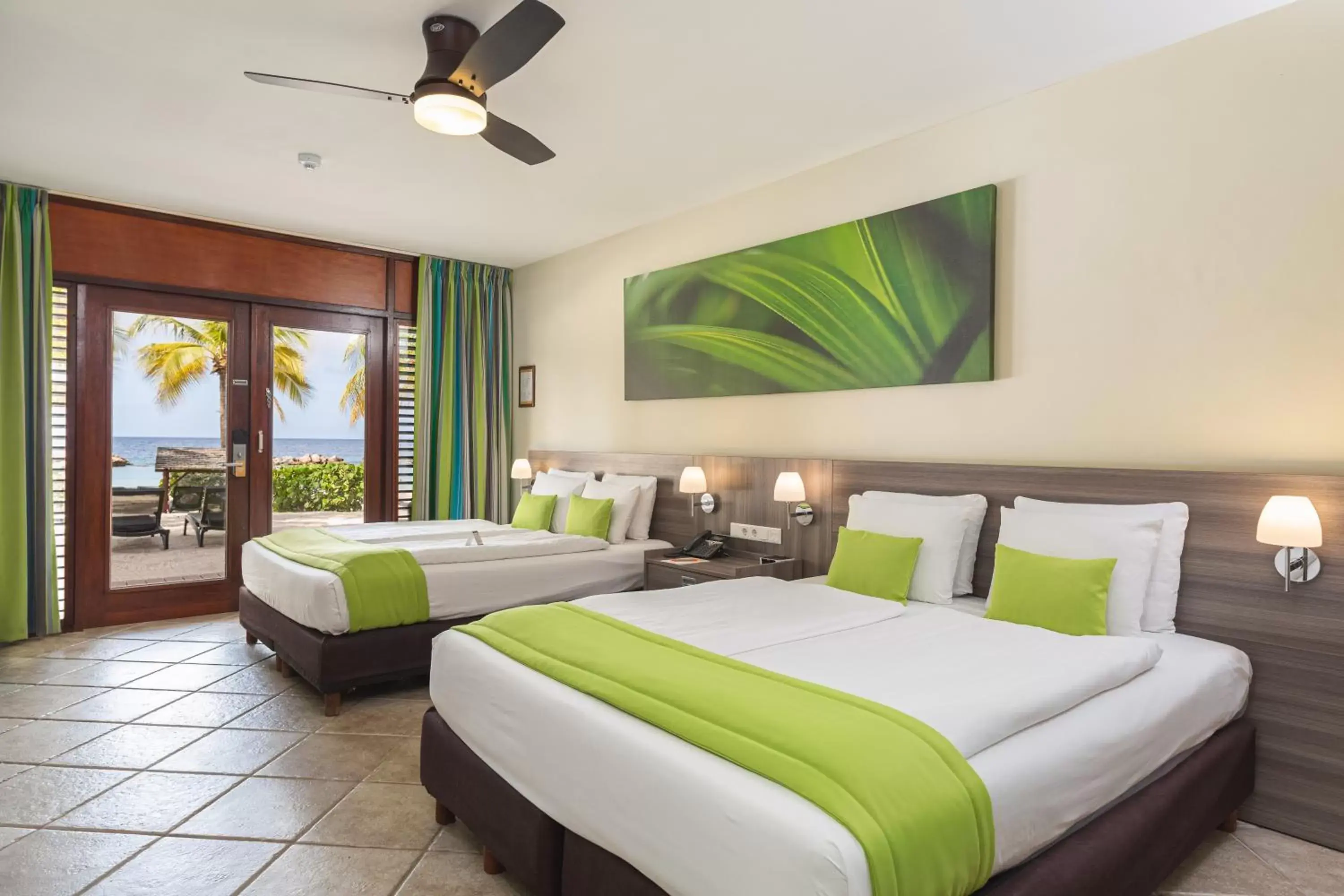 Photo of the whole room, Bed in LionsDive Beach Resort