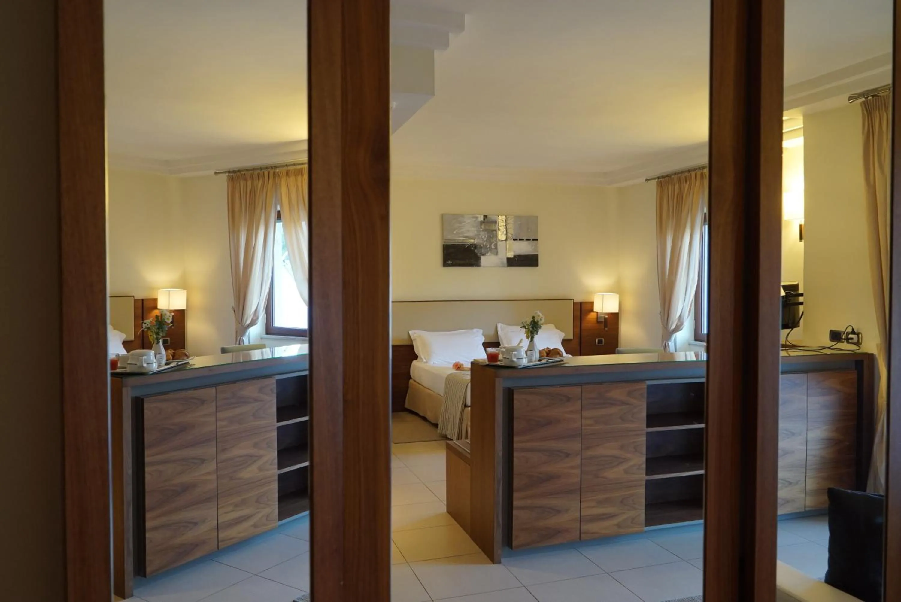 Bed in Suites & Residence Hotel