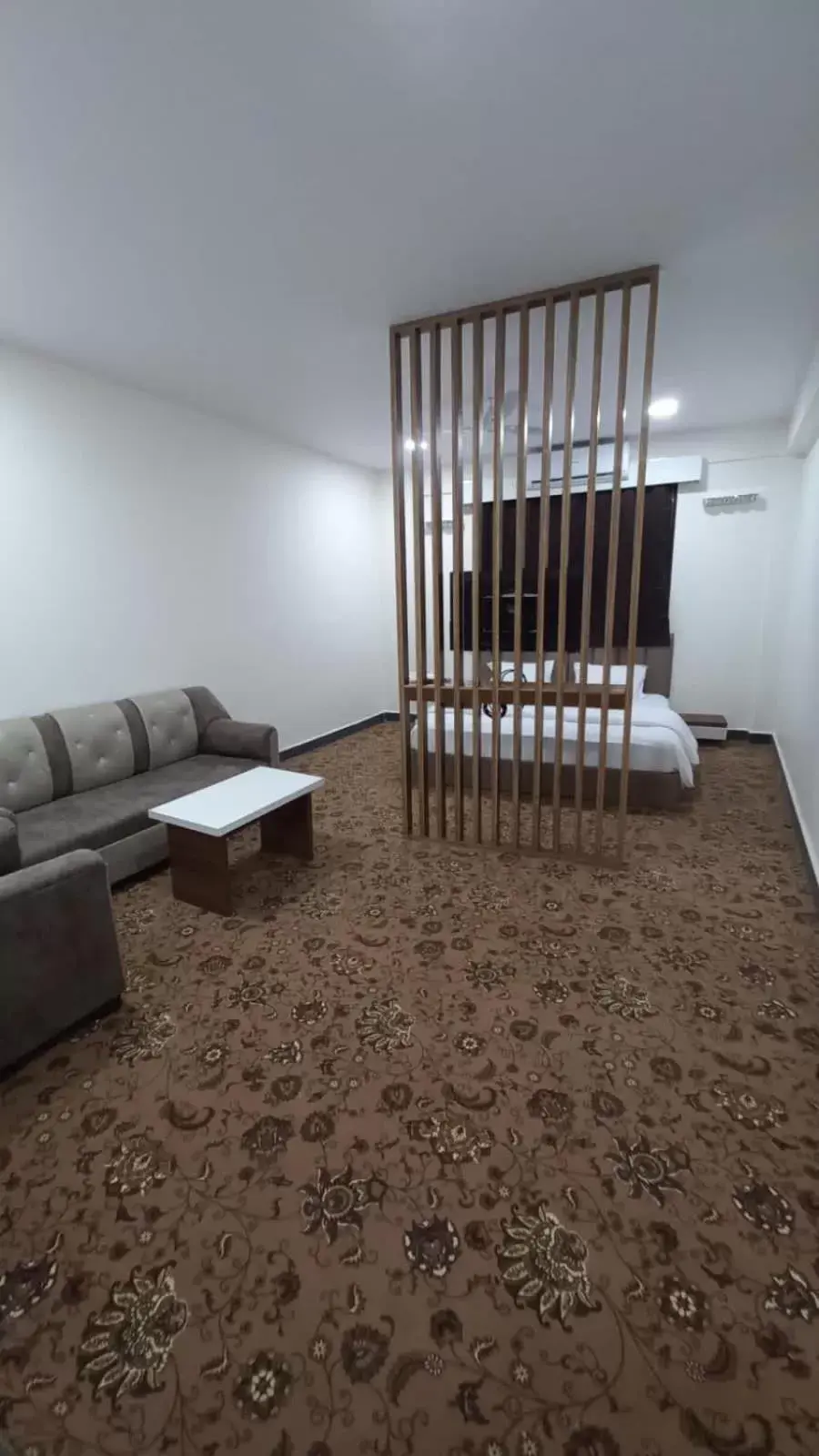 Seating area, Bed in Hotel Jurkis, Kolhapur Seating area, Bed in Hotel Jurkis, Kolhapur