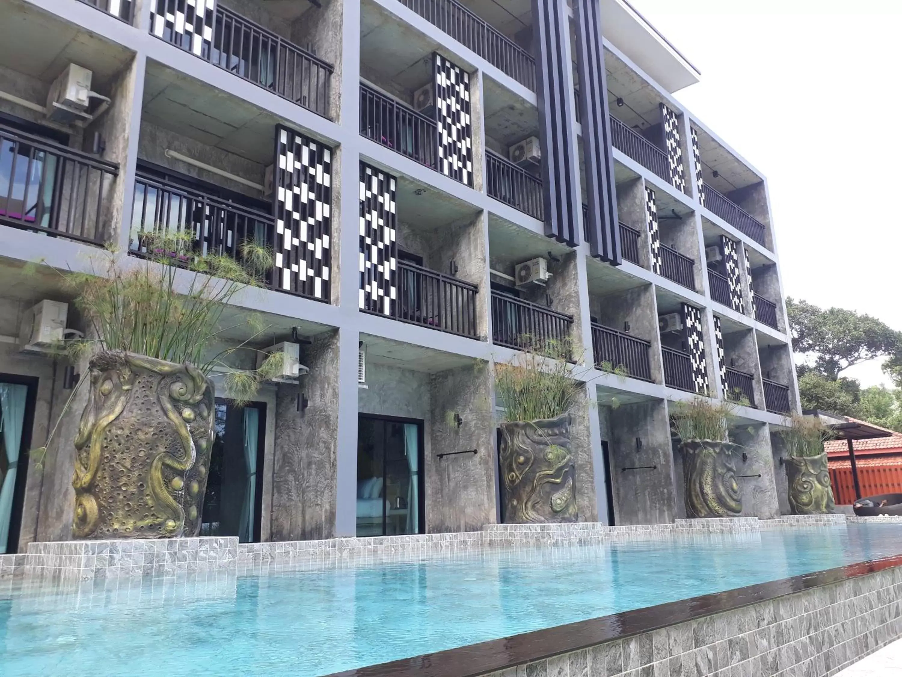 Swimming pool, Property Building in Maneetel Krabi Beachfront-SHA Plus