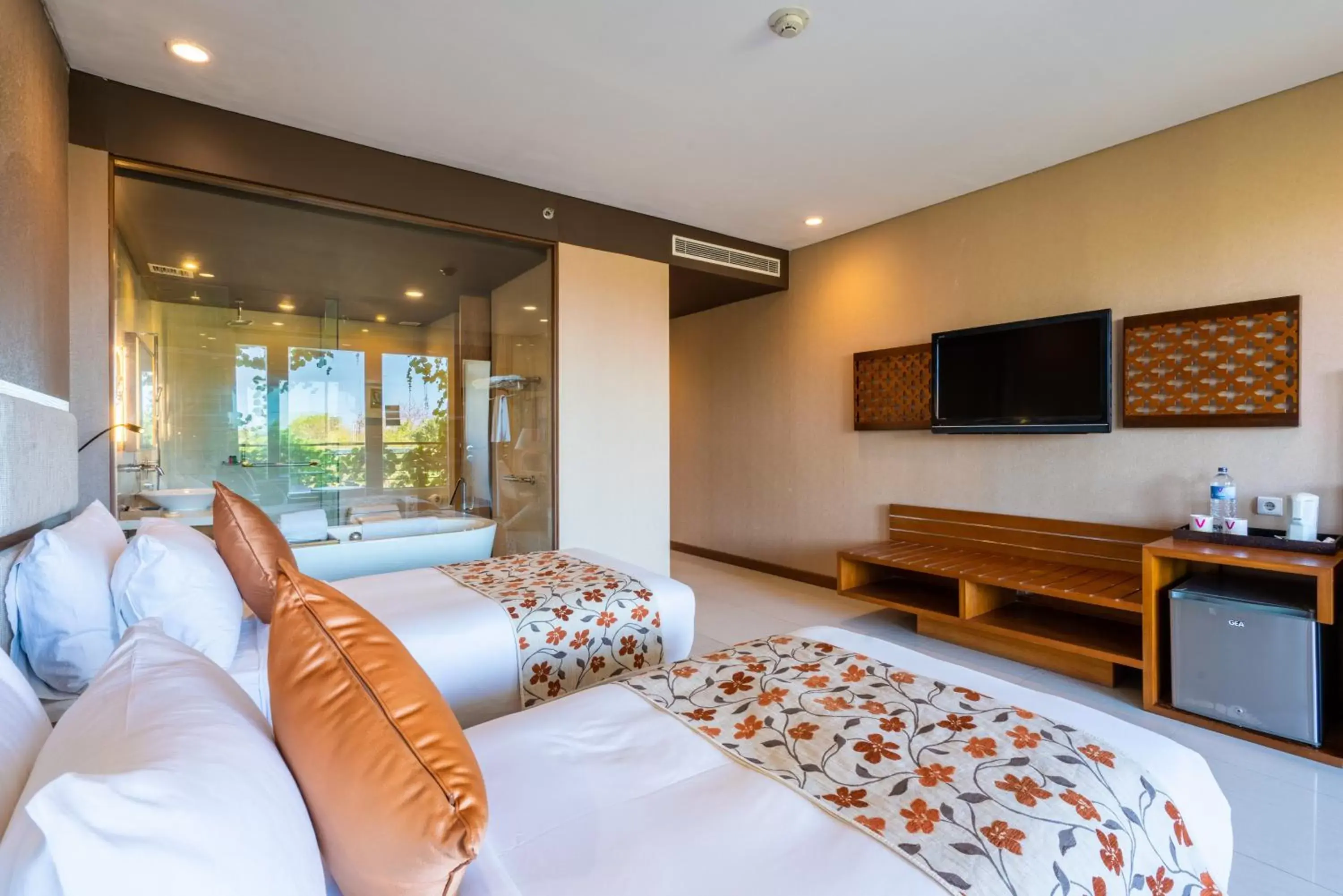 Bed, TV/Entertainment Center in Vouk Hotel and Suites