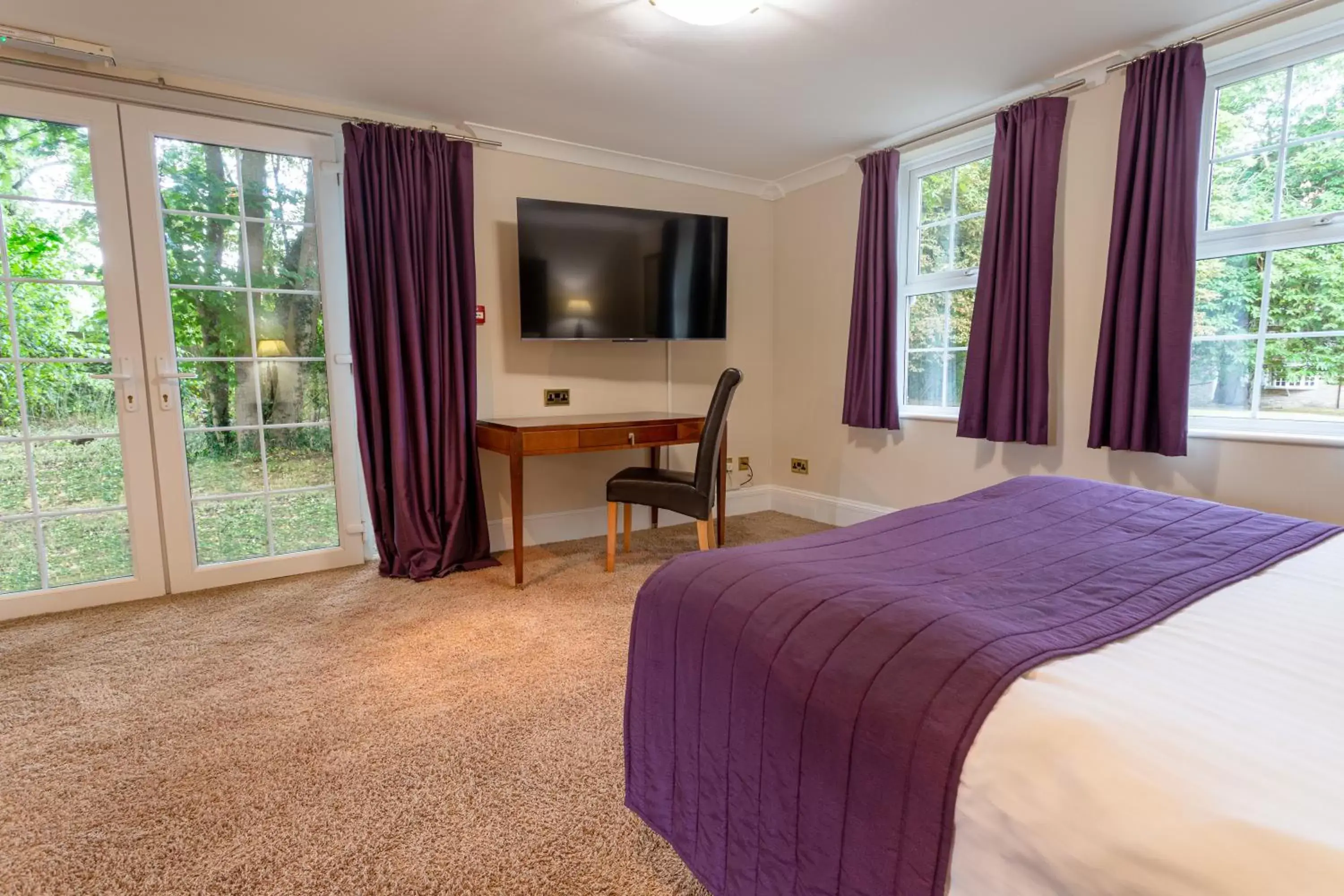 Bedroom in Woodland Manor Hotel