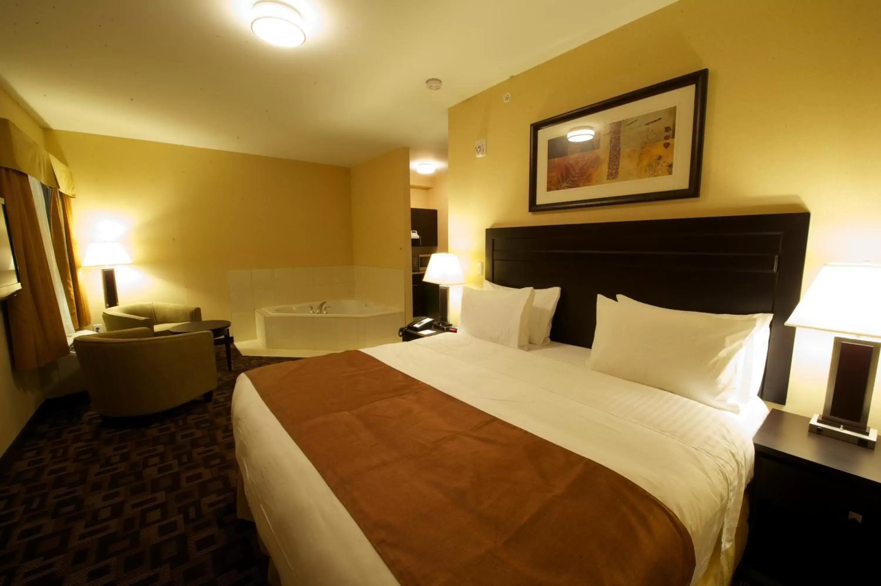 Photo of the whole room, Bed in Days Inn & Suites by Wyndham Winnipeg Airport Manitoba