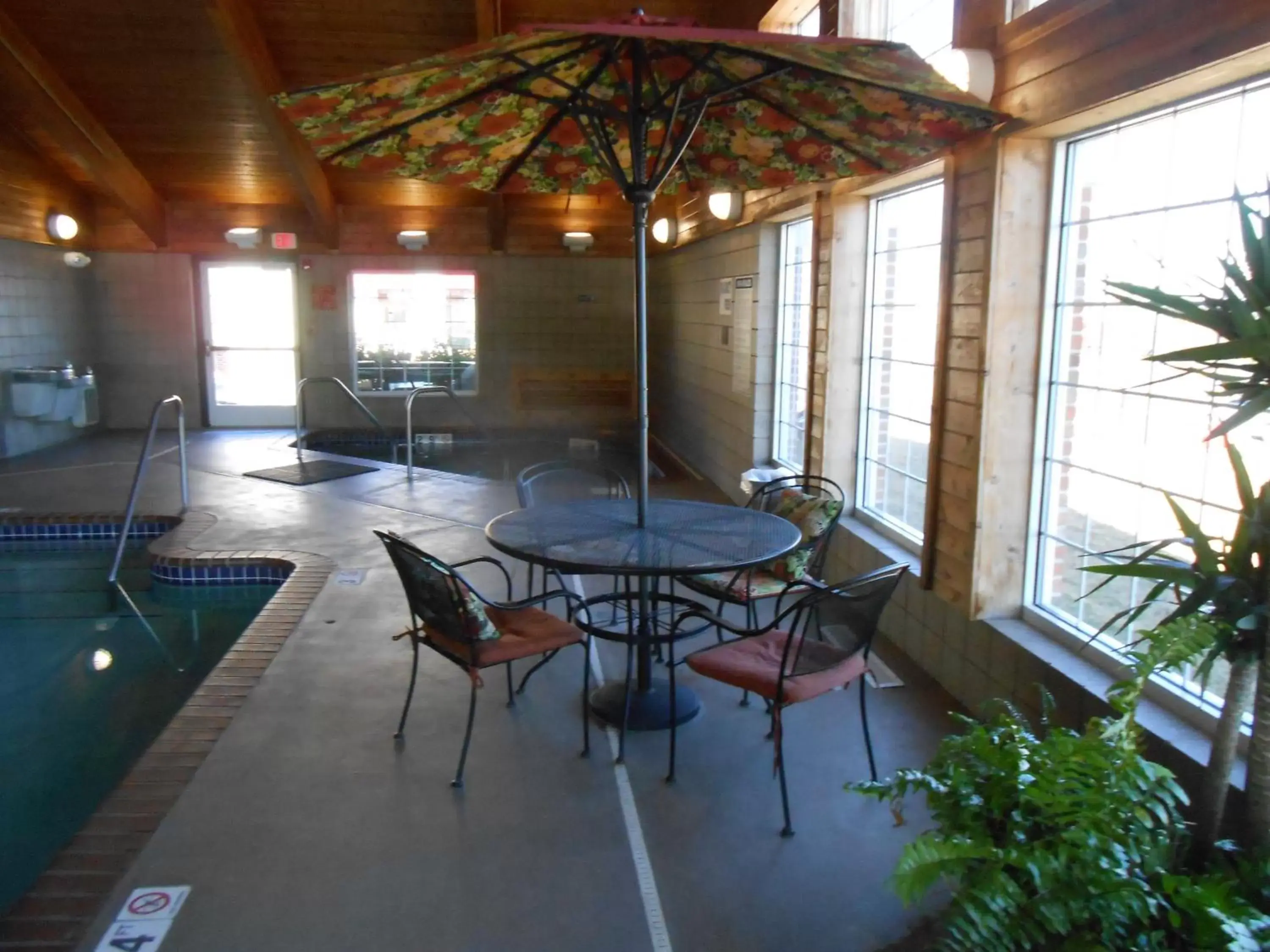 Seating area in AmericInn by Wyndham McAlester