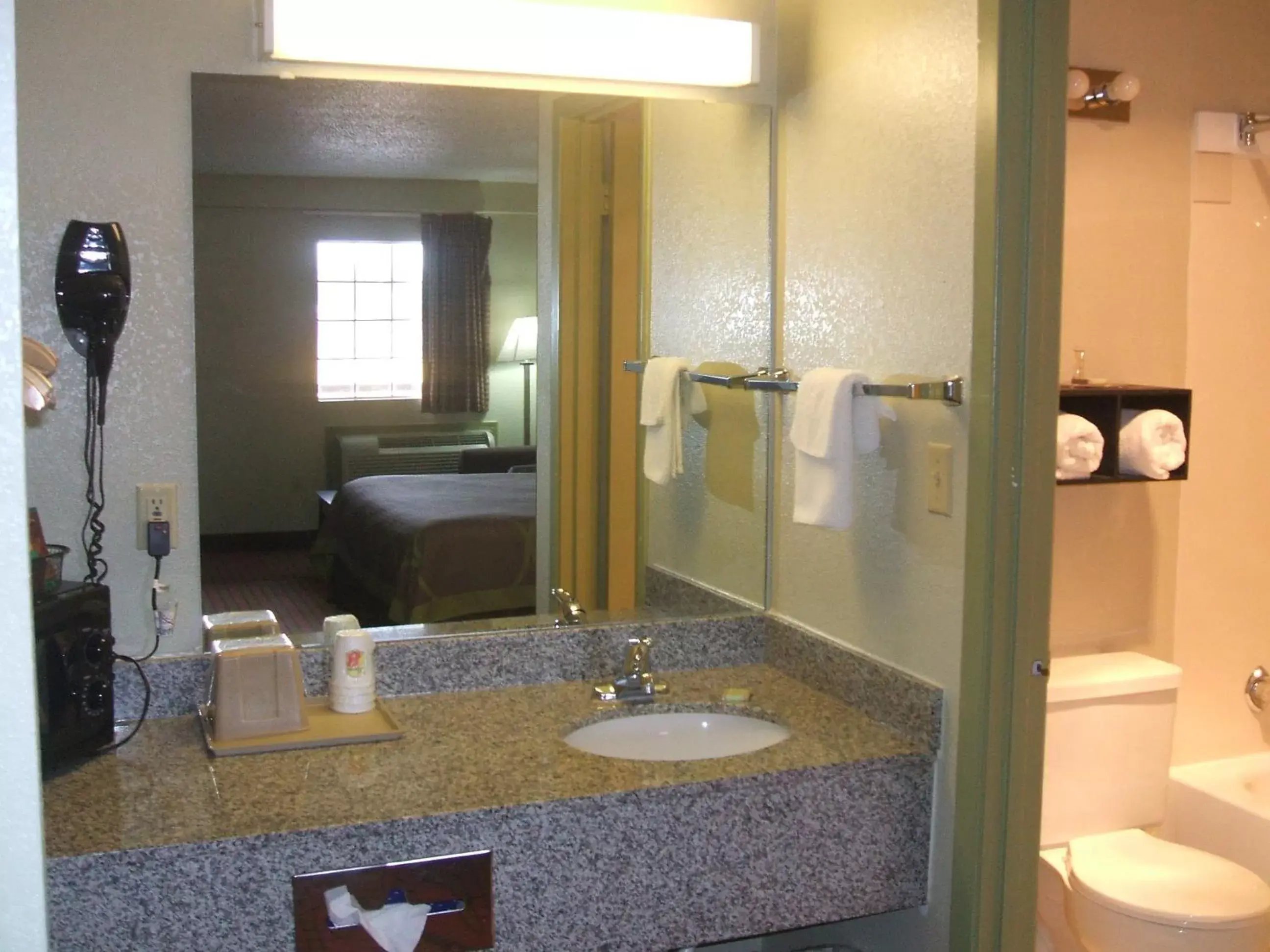 Bathroom in Super 8 by Wyndham Monticello AR