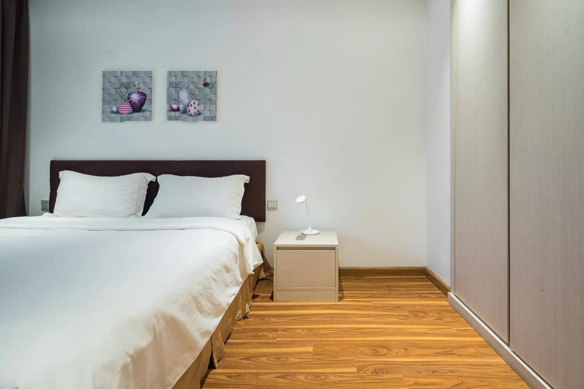 Bed in HNC Premier Hotel & Residences