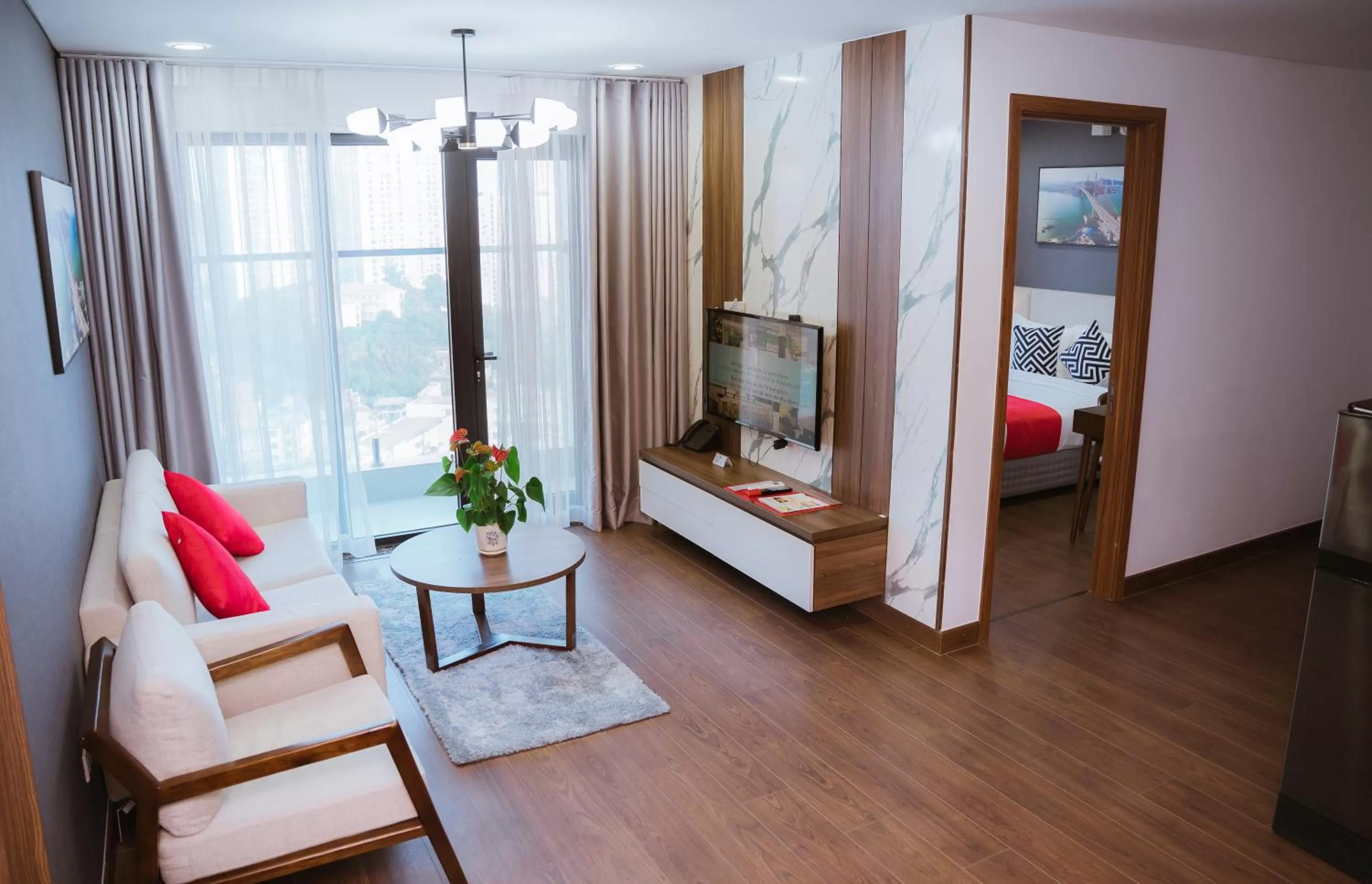 Living room, Bed in Ramada Hotel & Suites by Wyndham Halong Bay View