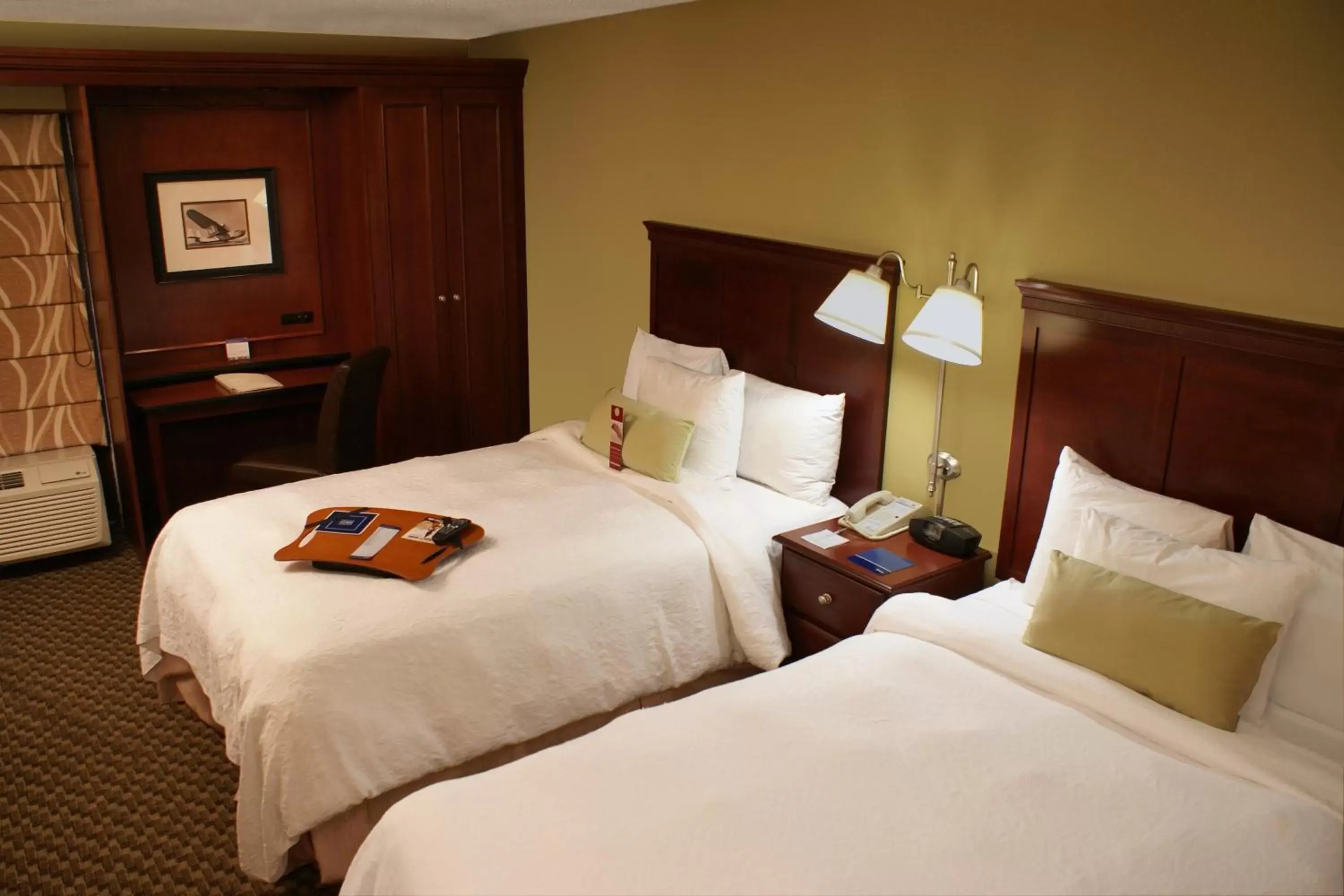 Bed in The Addison Hotel SureStay Collection by Best Western