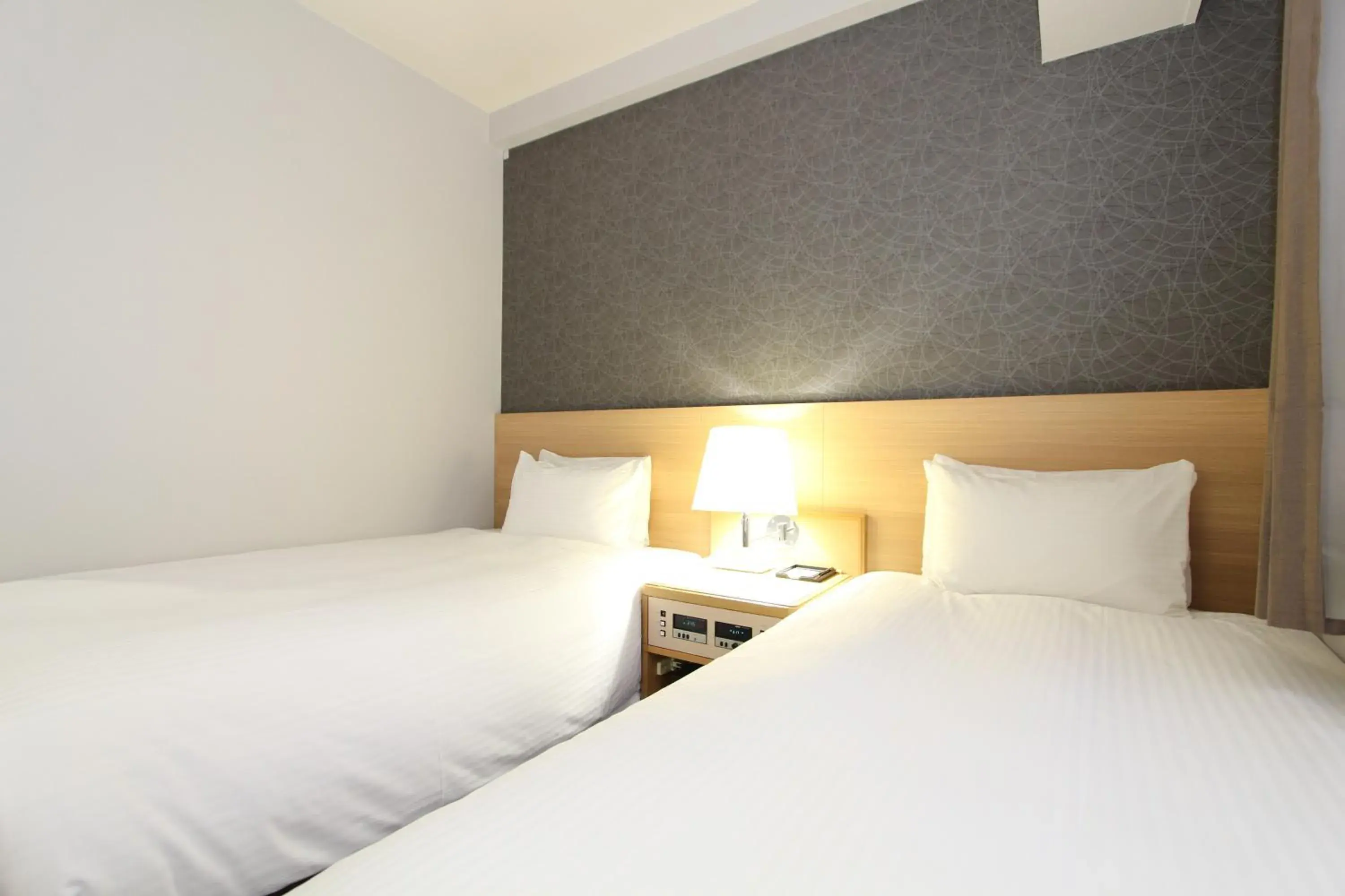 Bed in SureStay Plus Hotel by Best Western Shin-Osaka