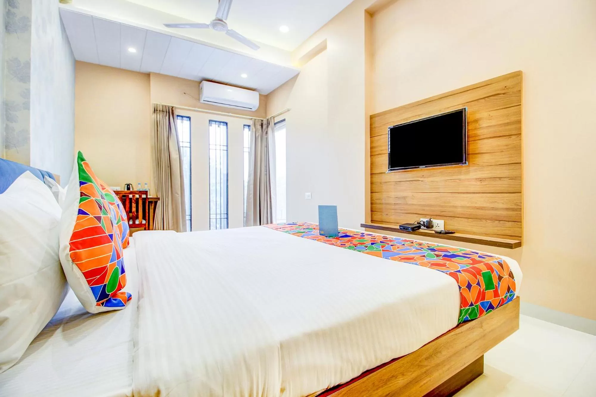 Seating area, Bed in FabHotel 7th Crossing Malviya Nagar