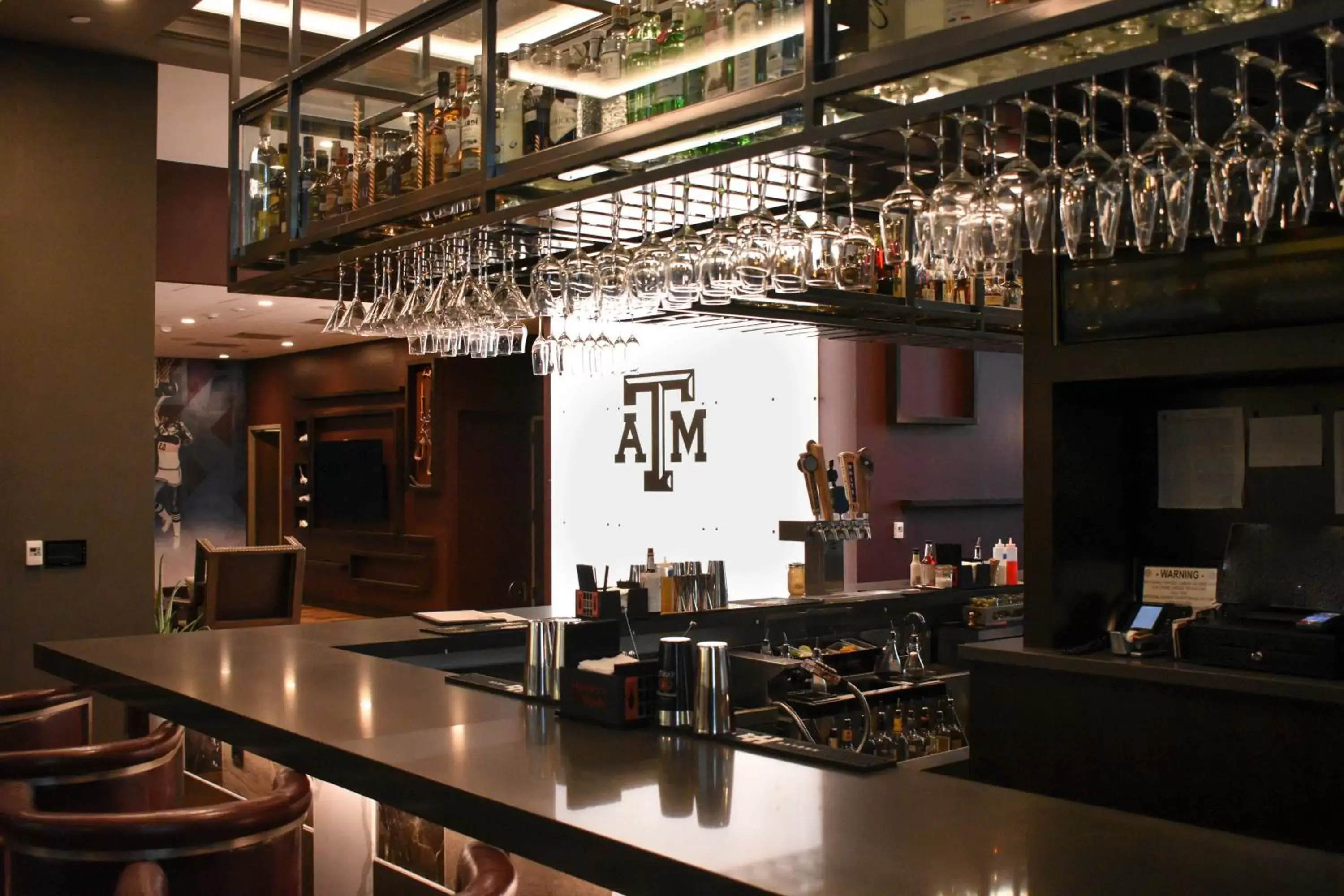 Lounge or bar in Texas A&M Hotel and Conference Center Lounge or bar in Texas A&M Hotel and Conference Center