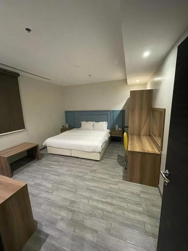 Bed in Stay Inn Suites