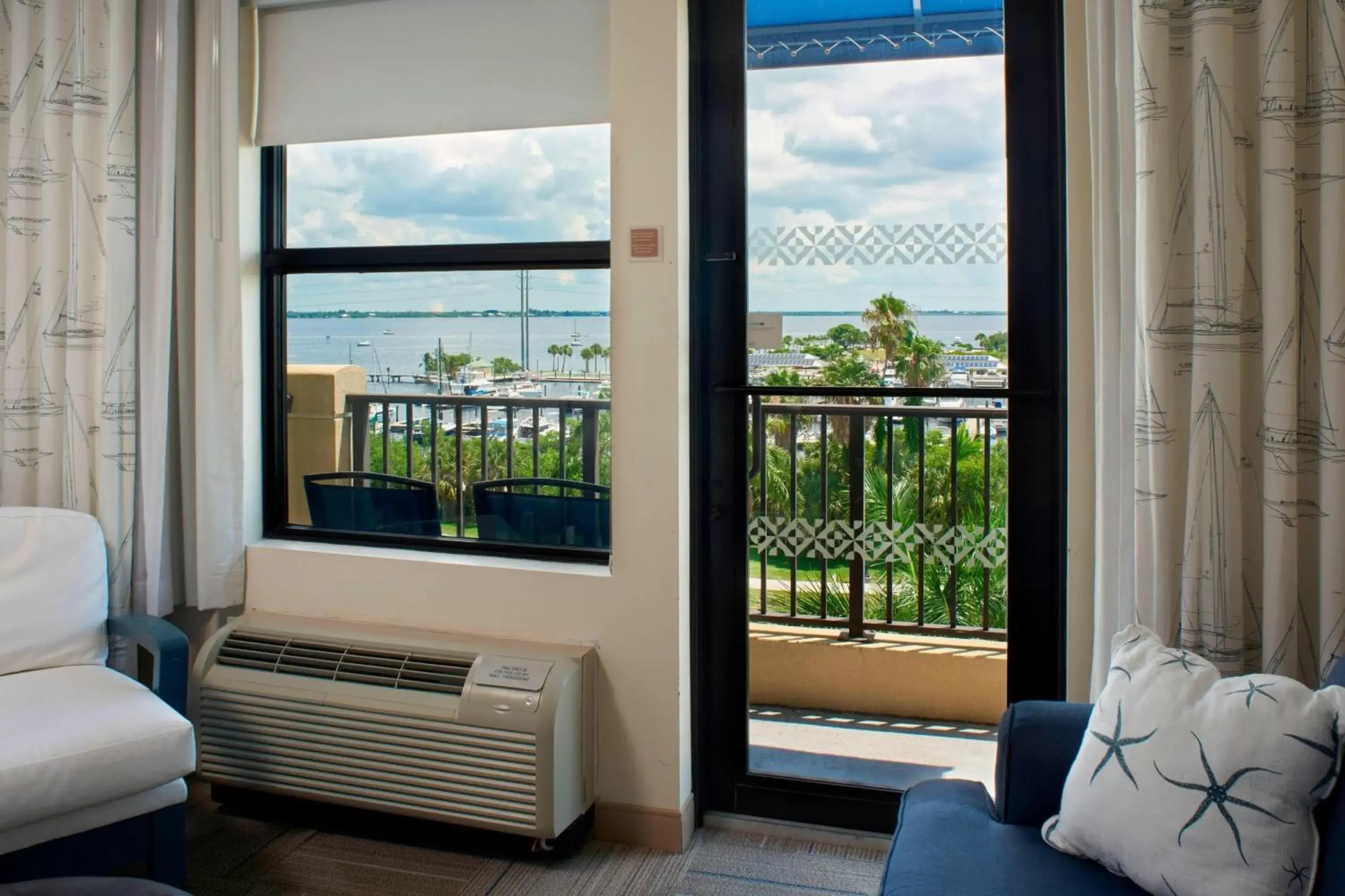 Photo of the whole room, Seating Area in Four Points By Sheraton Punta Gorda Harborside