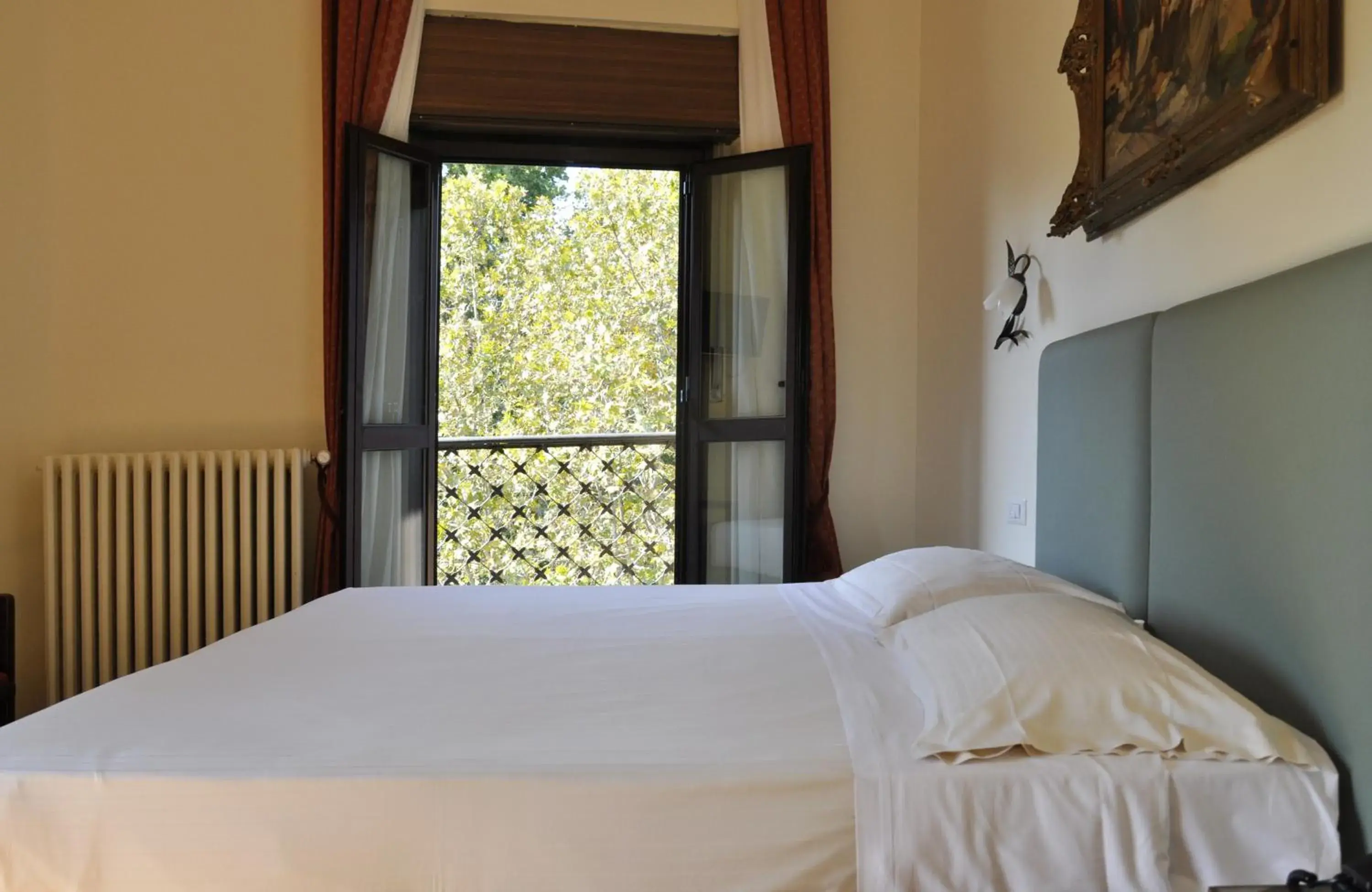 Bed in Hotel San Guido