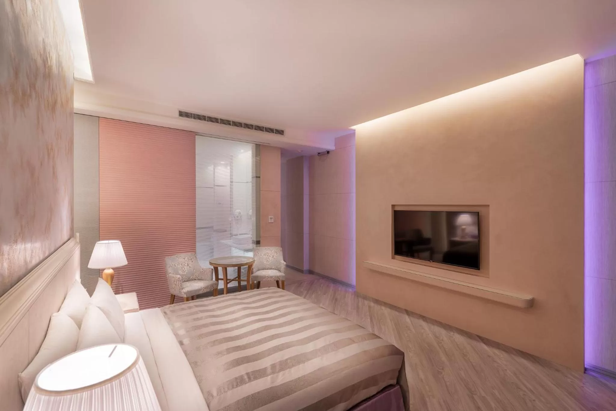 Bed in Purple Garden Motel