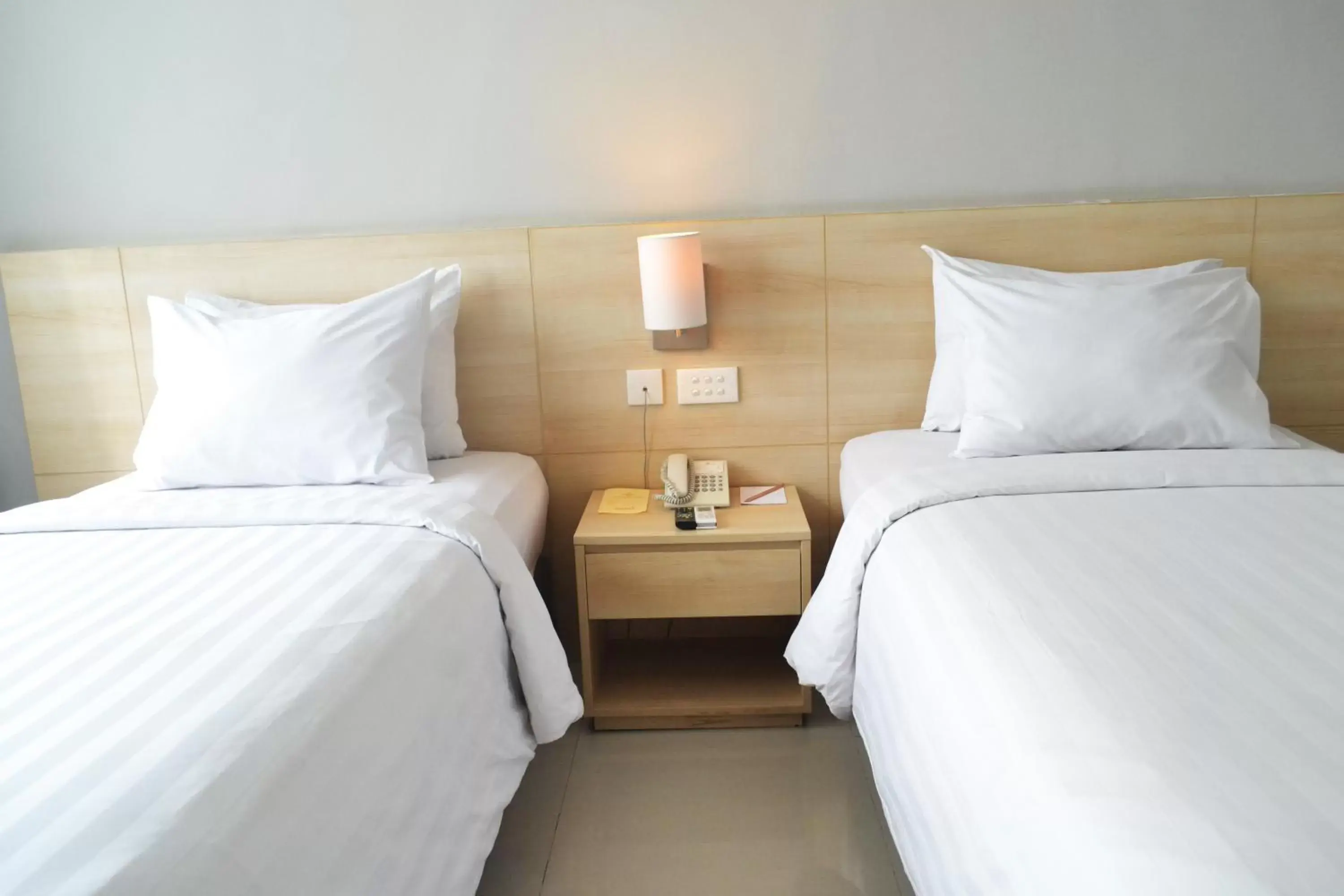 Bed in Grand Cakra Hotel Malang