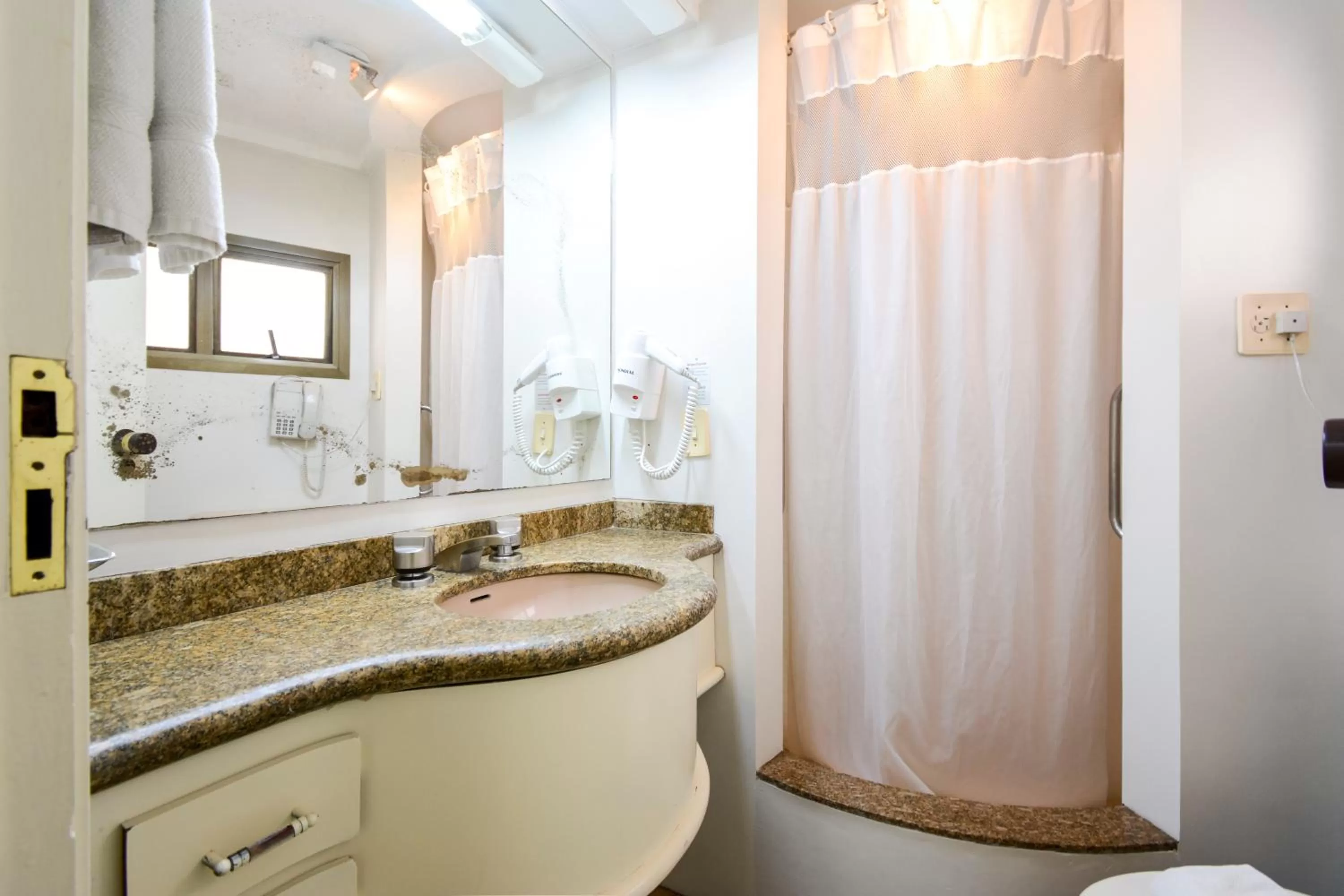 Bathroom in Wall Street Apartments by BnbHost