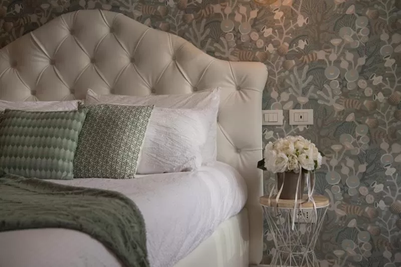 Bed in Lainez Rooms & Suites