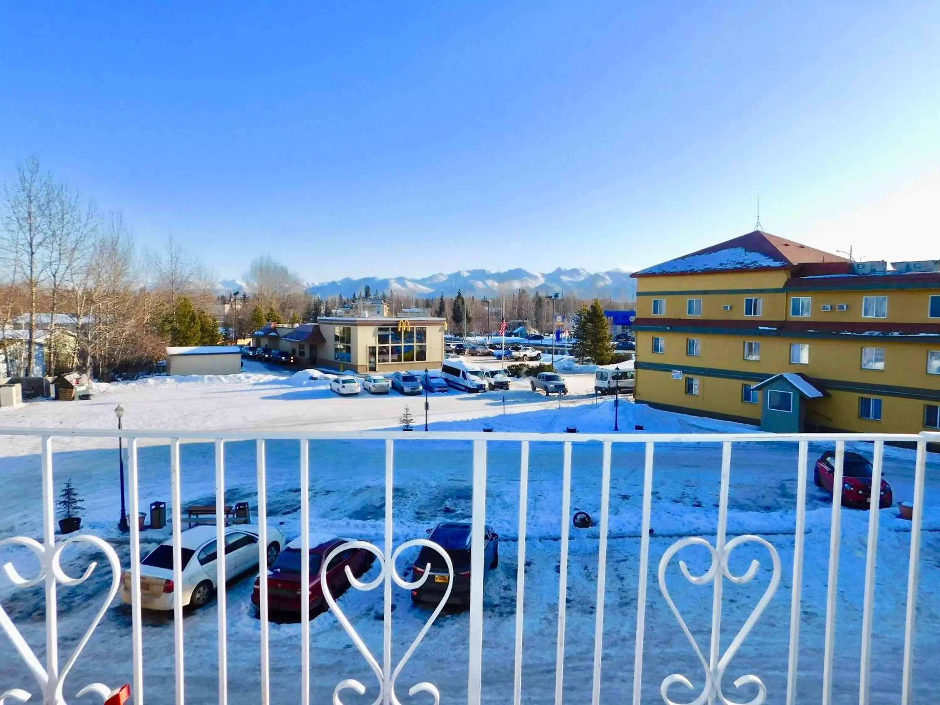 Balcony/Terrace, Swimming Pool in Americas Best Value Inn & Suites Anchorage Airport