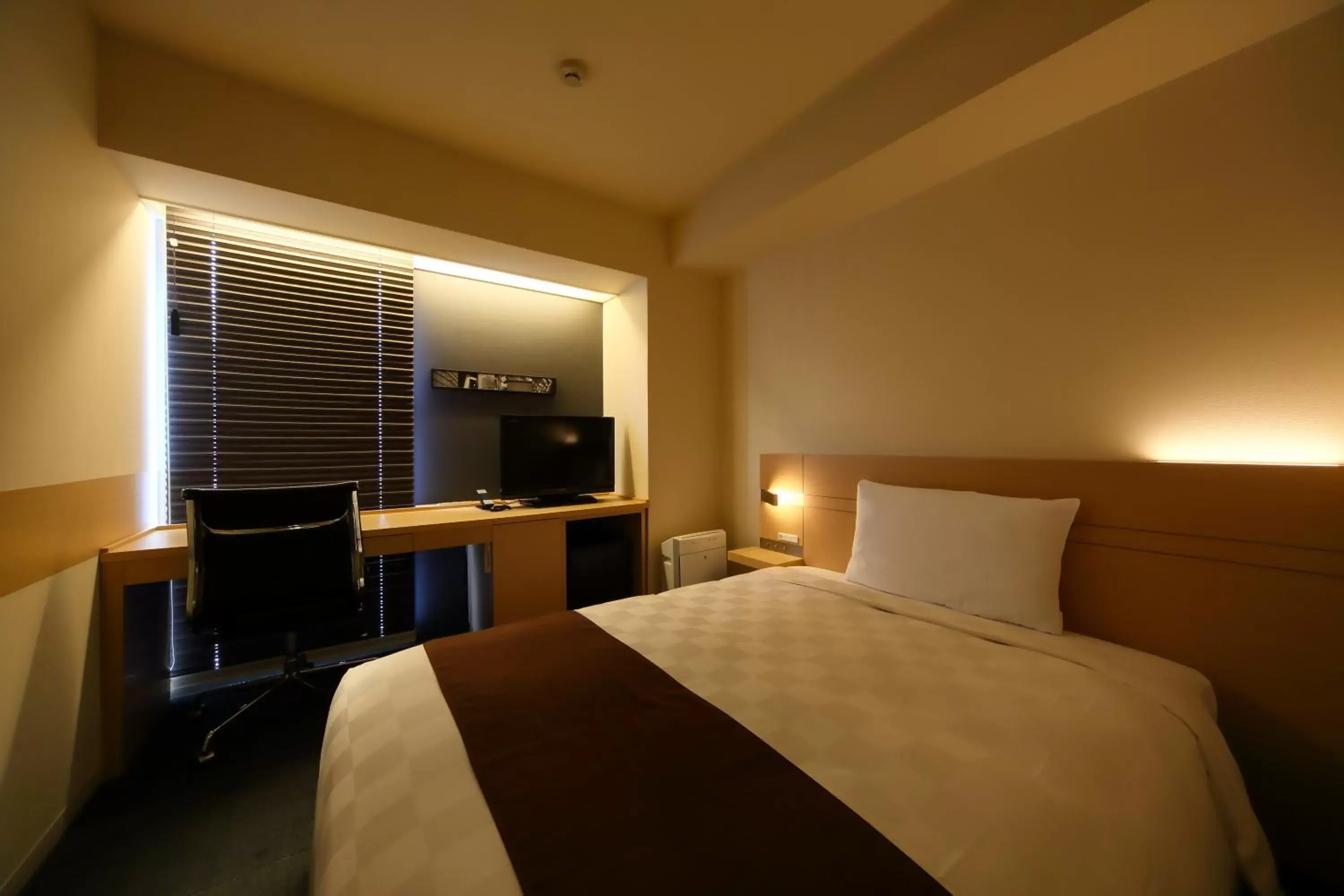 Bed in Hakata Tokyu REI Hotel