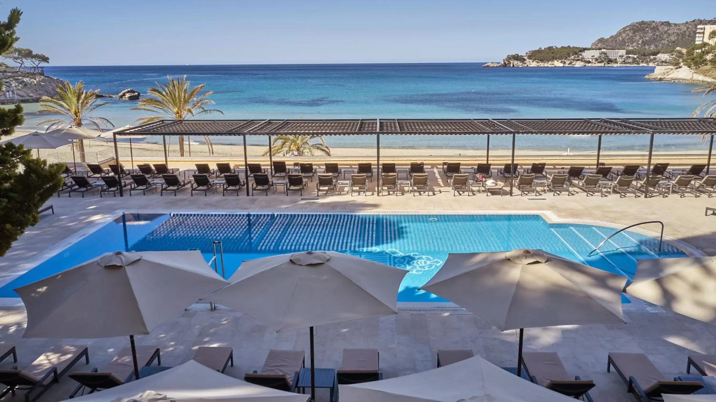 Solarium, Swimming Pool in Secrets Mallorca Villamil Resort & Spa - Adults Only (+18)