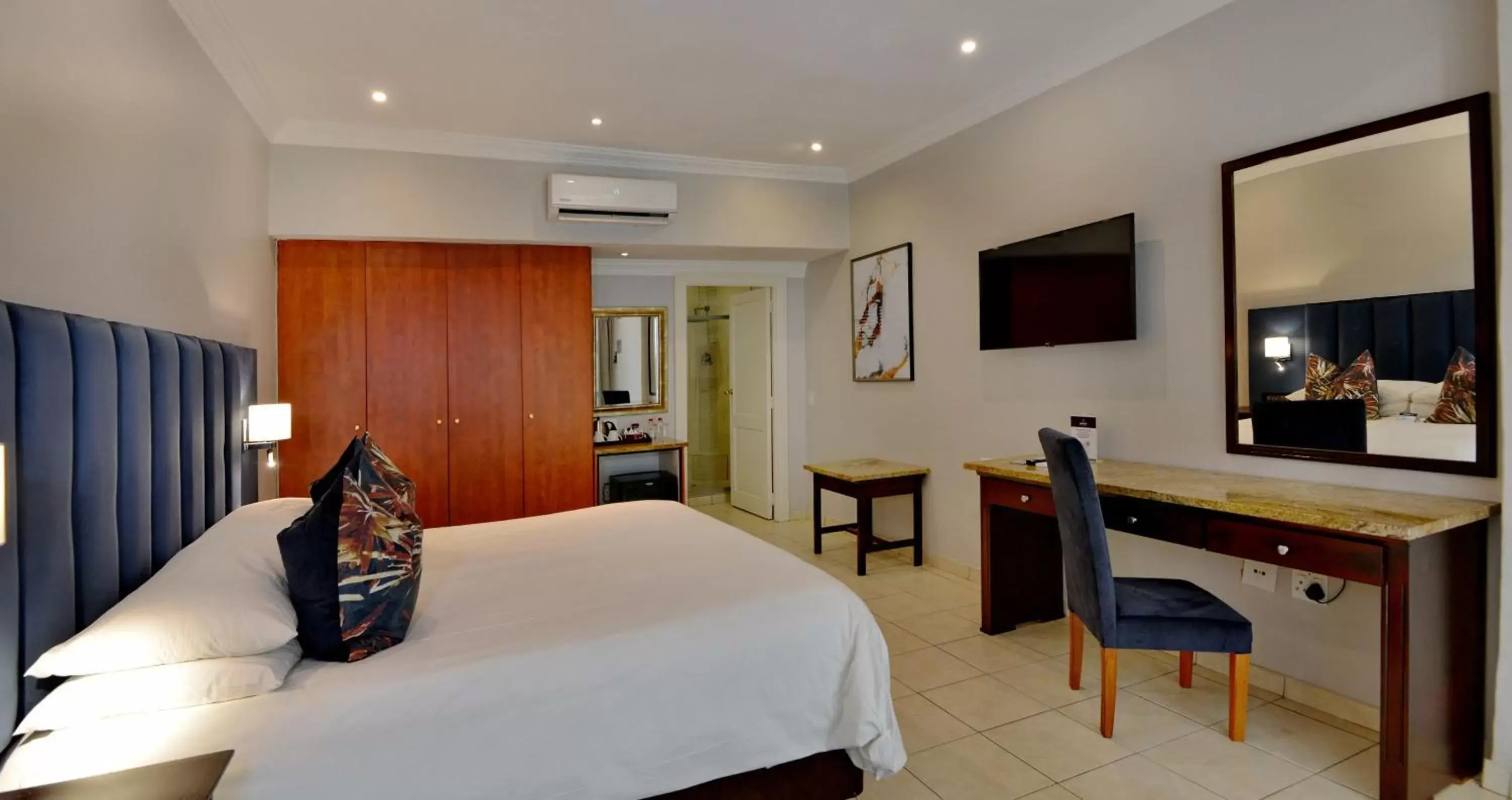 Bed, TV/Entertainment Center in ANEW Resort Hunters Rest Rustenburg