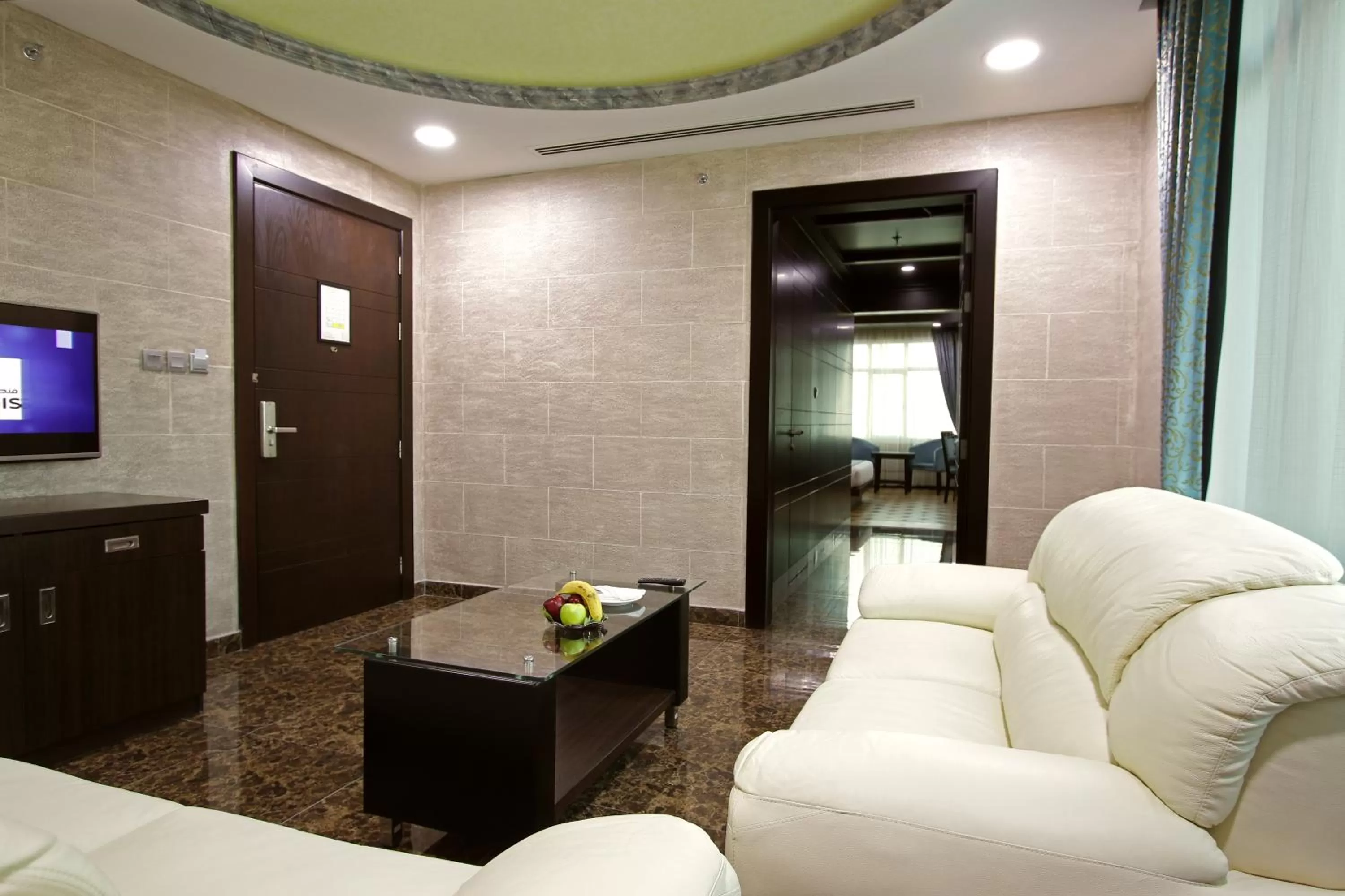 Living room in Park Regis Lotus Hotel