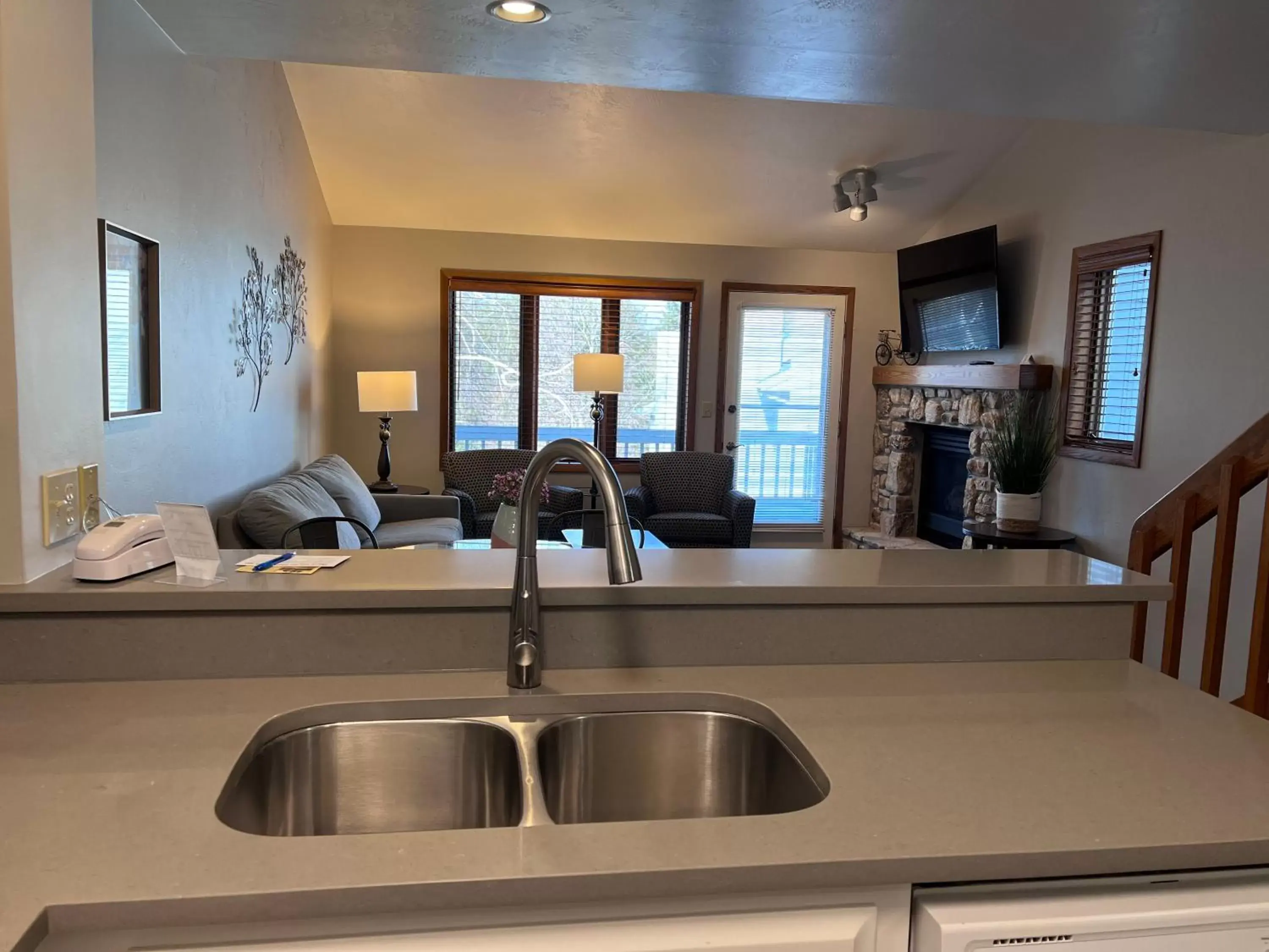 Living room, Kitchen/Kitchenette in Homestead Suites - Fish Creek