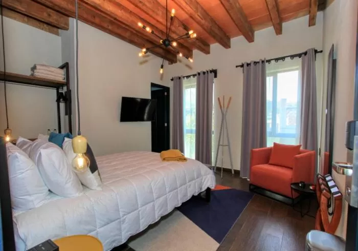 Bed in Antigua Trece Hotel Fusión