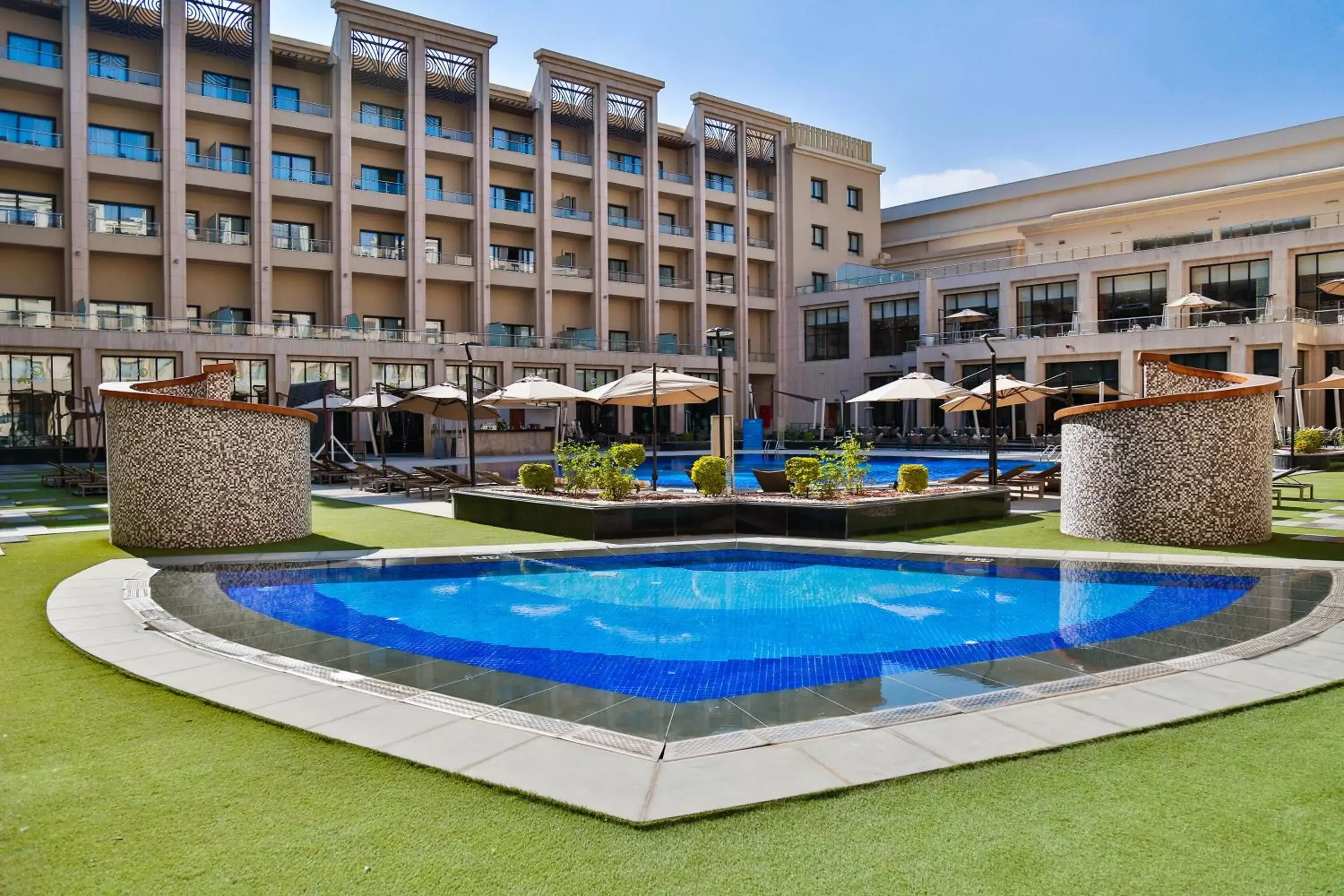 Swimming pool, Property Building in Triumph Luxury Hotel