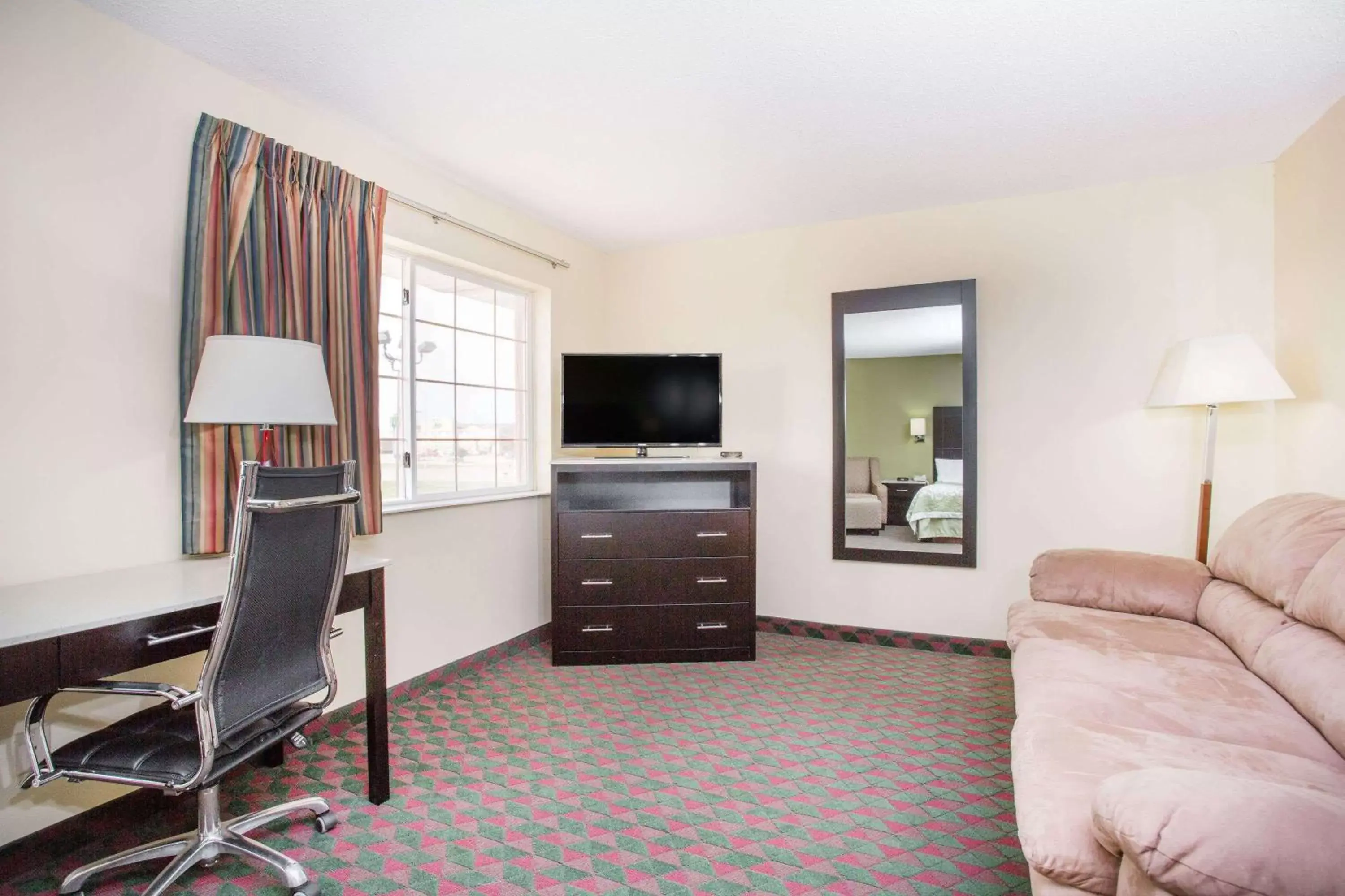 Photo of the whole room, TV/Entertainment Center in Days Inn by Wyndham Lexington NE