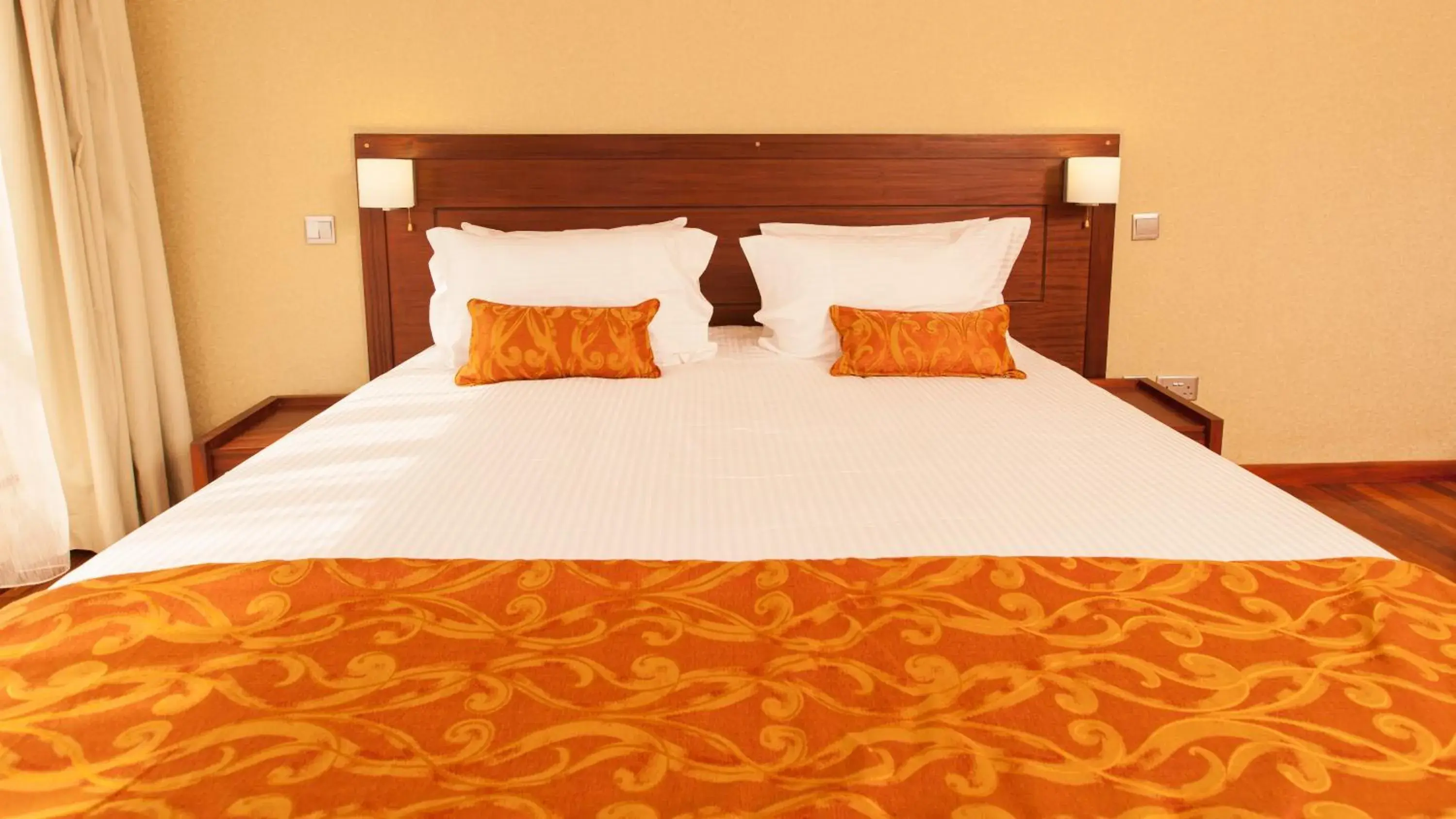 Bed in Waridi Paradise Hotel and Suites