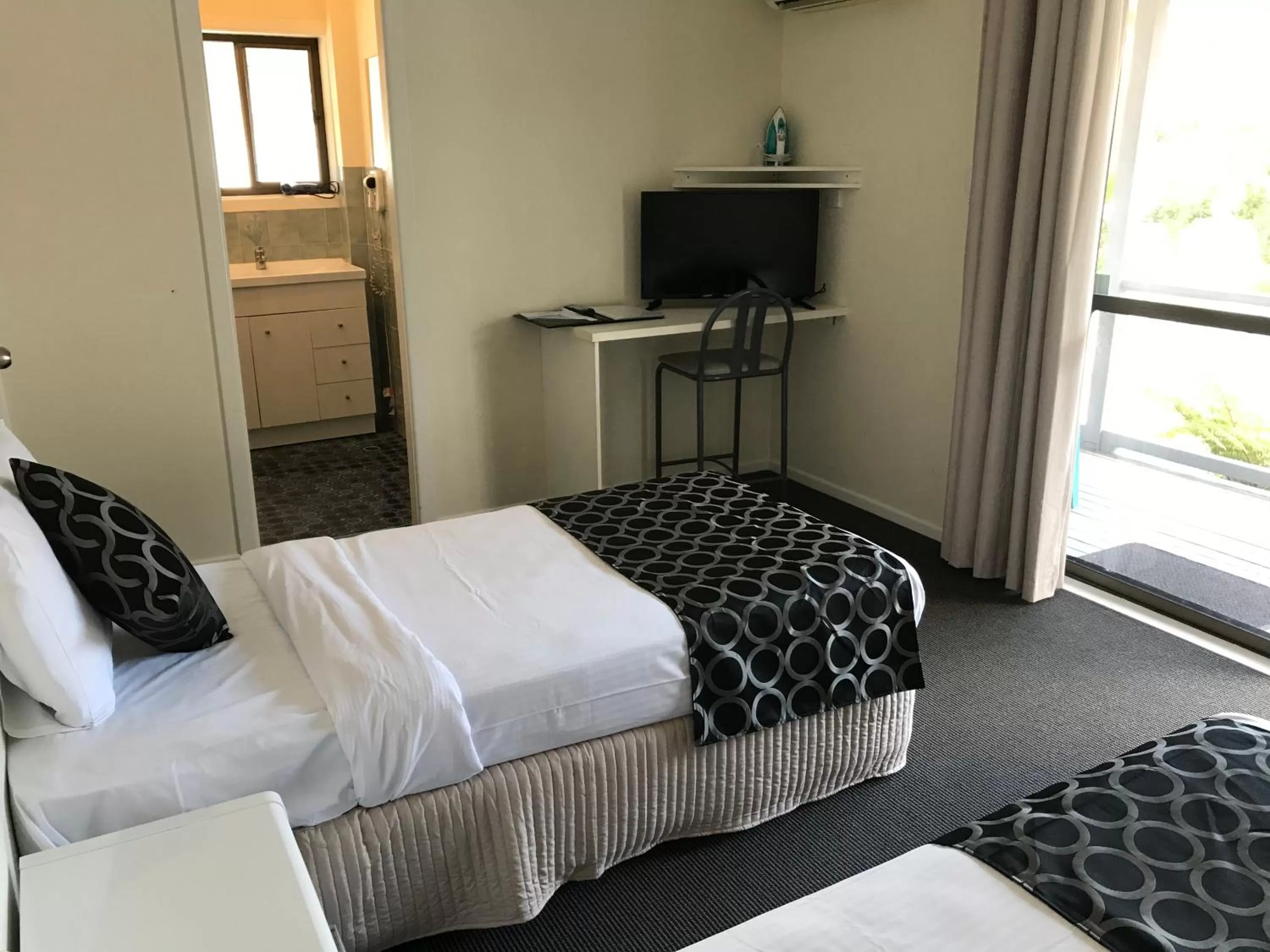 Bed in Coffs Shearwater Motel