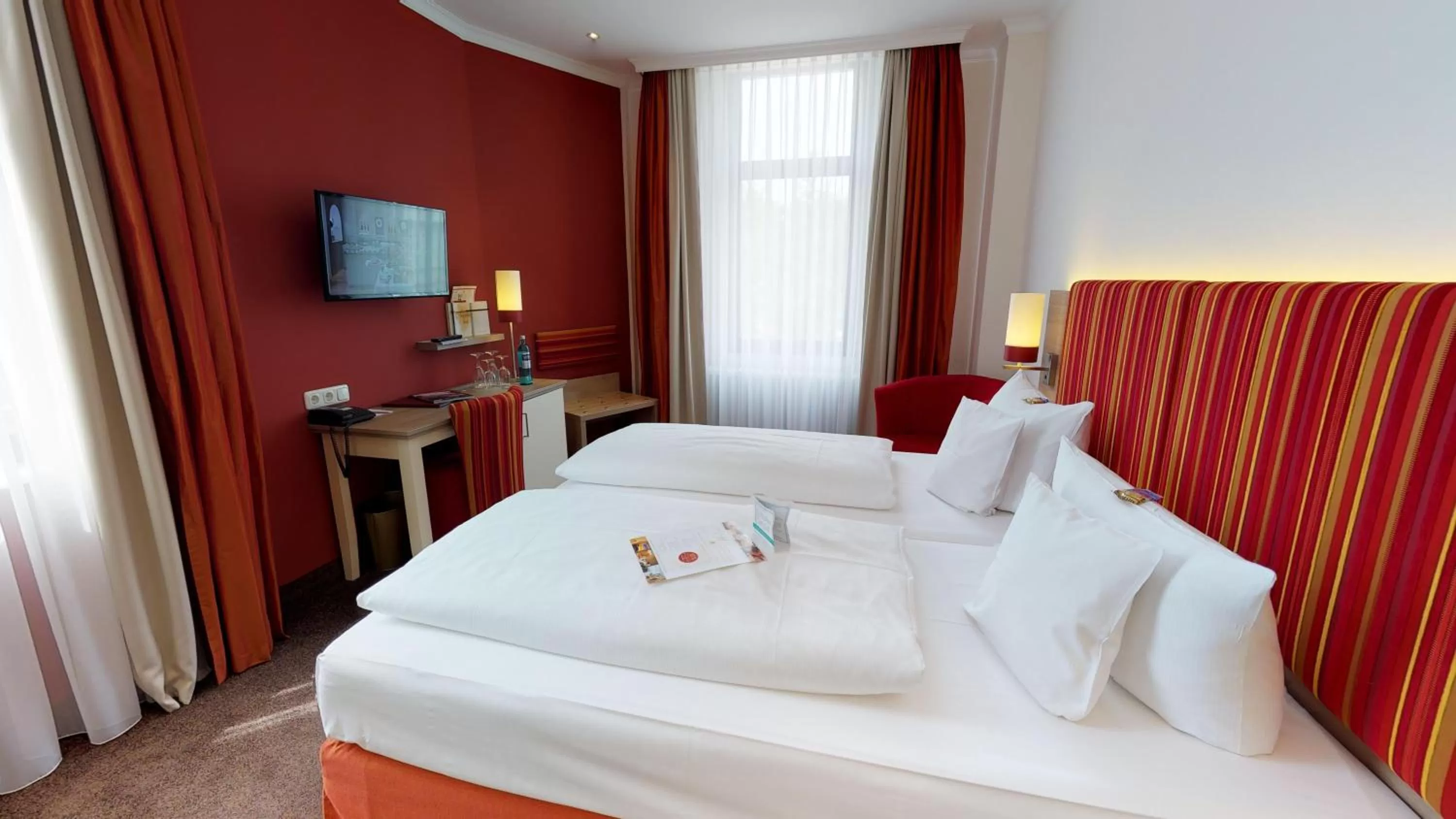 Bed in DORMERO Hotel Coburg