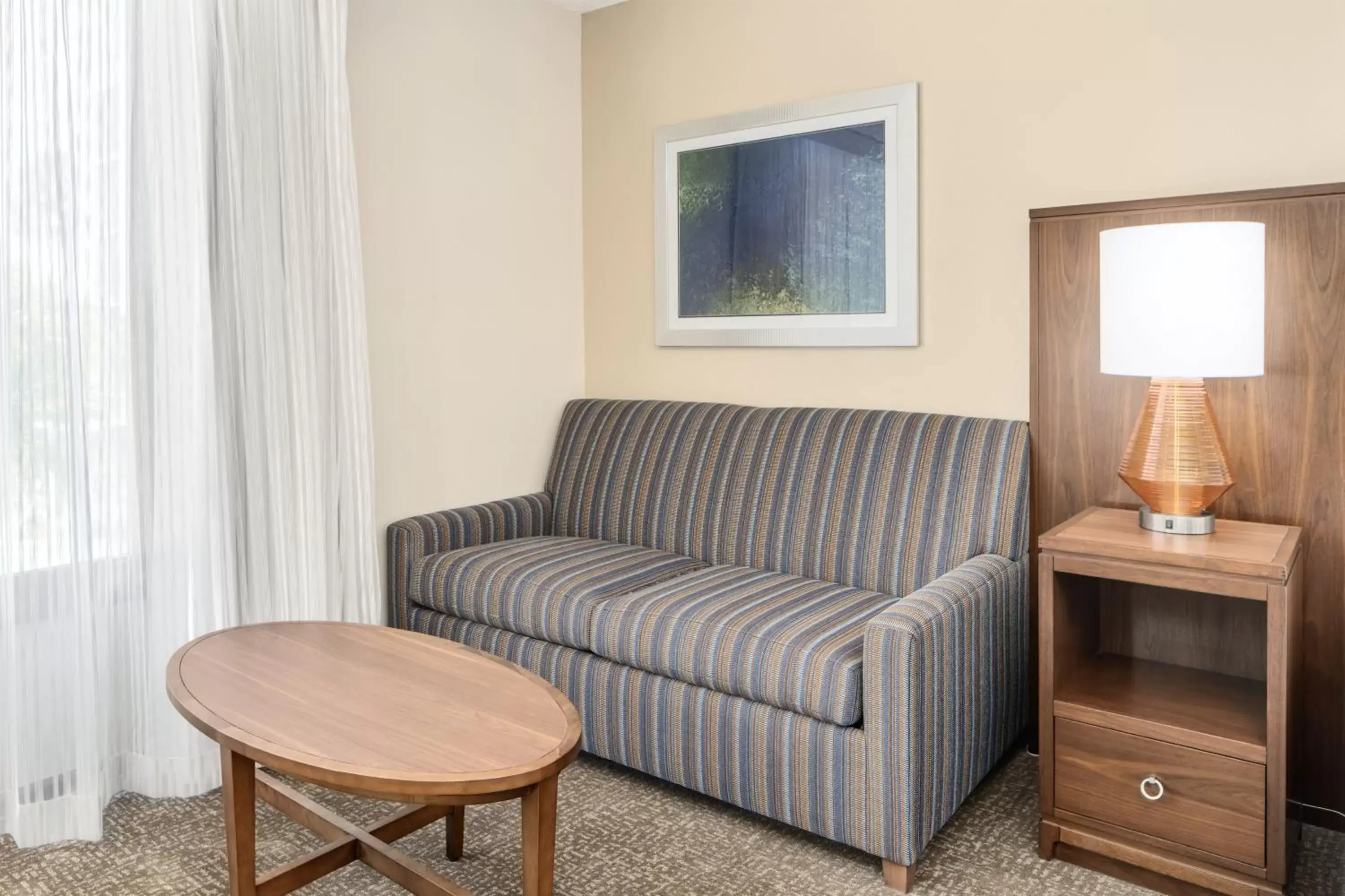 Bedroom, Seating Area in Crowne Plaza Hotel Fort Myers at Bell Tower Shops, an IHG Hotel