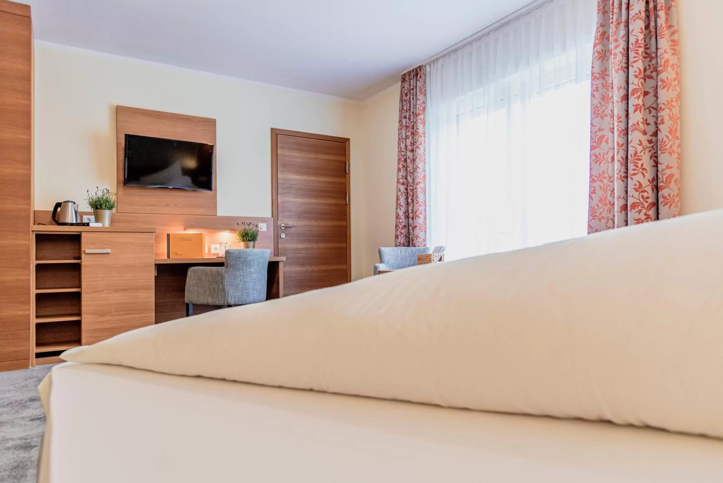 Bed in Wohlfühlhotel Goiserer Mühle